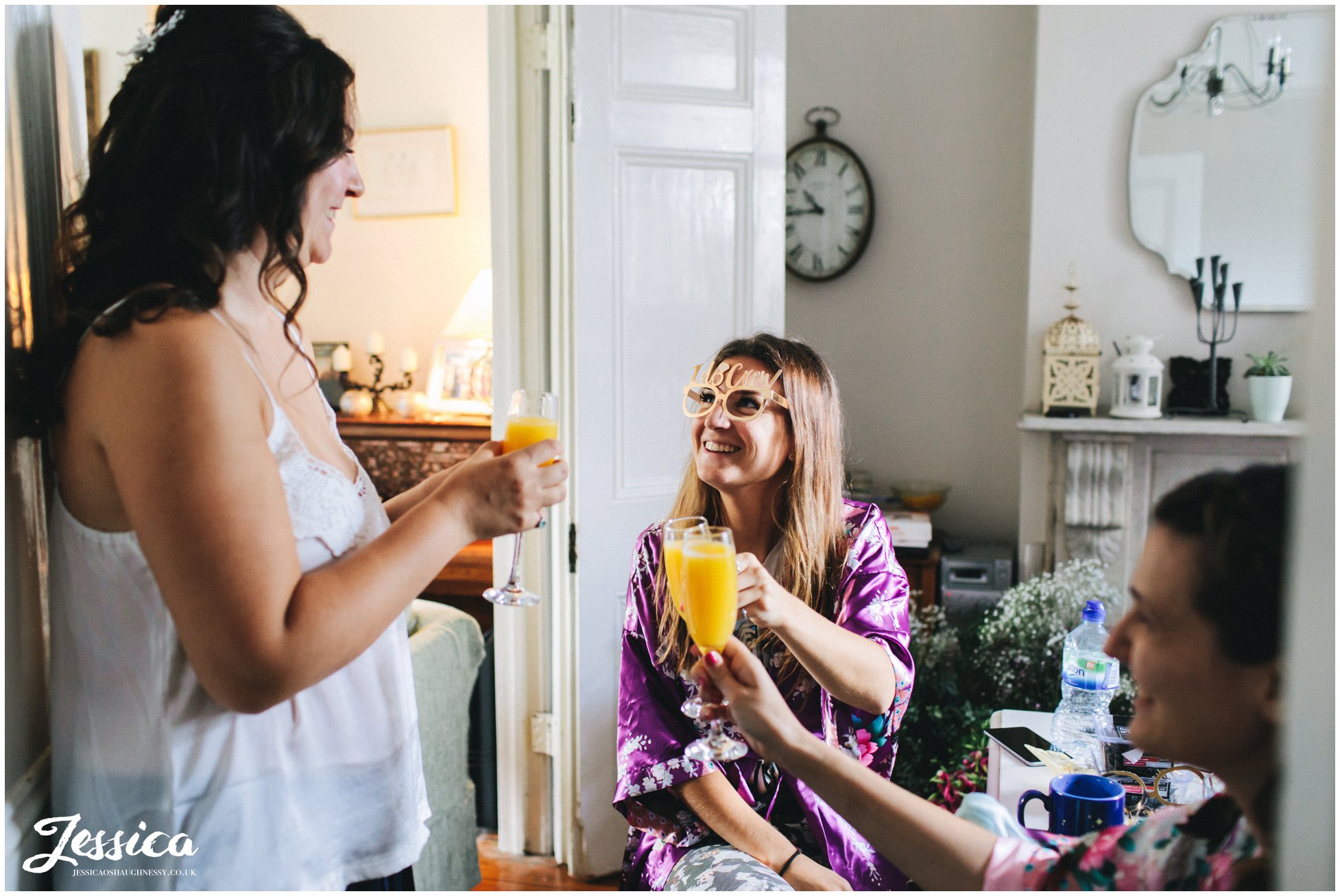 the bridal party cheers with bucks fizz