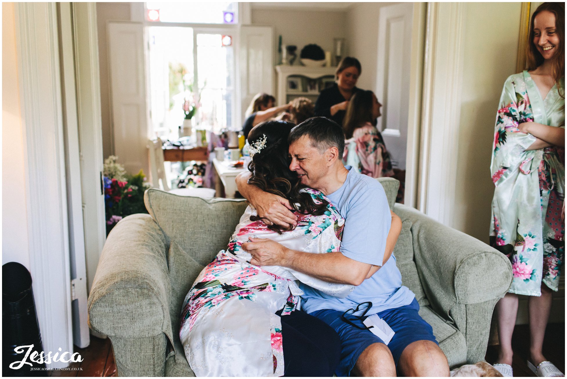 bride hugs her emotional father after giving him a gift