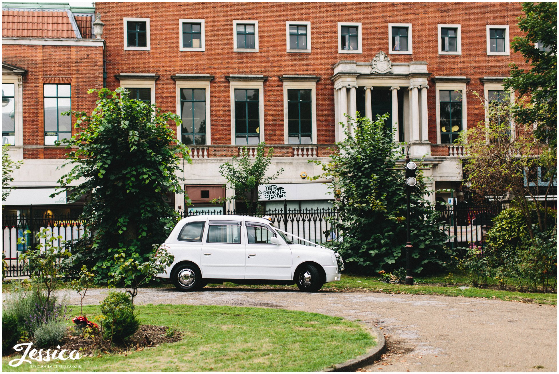 the bride arrives in a white mini cab