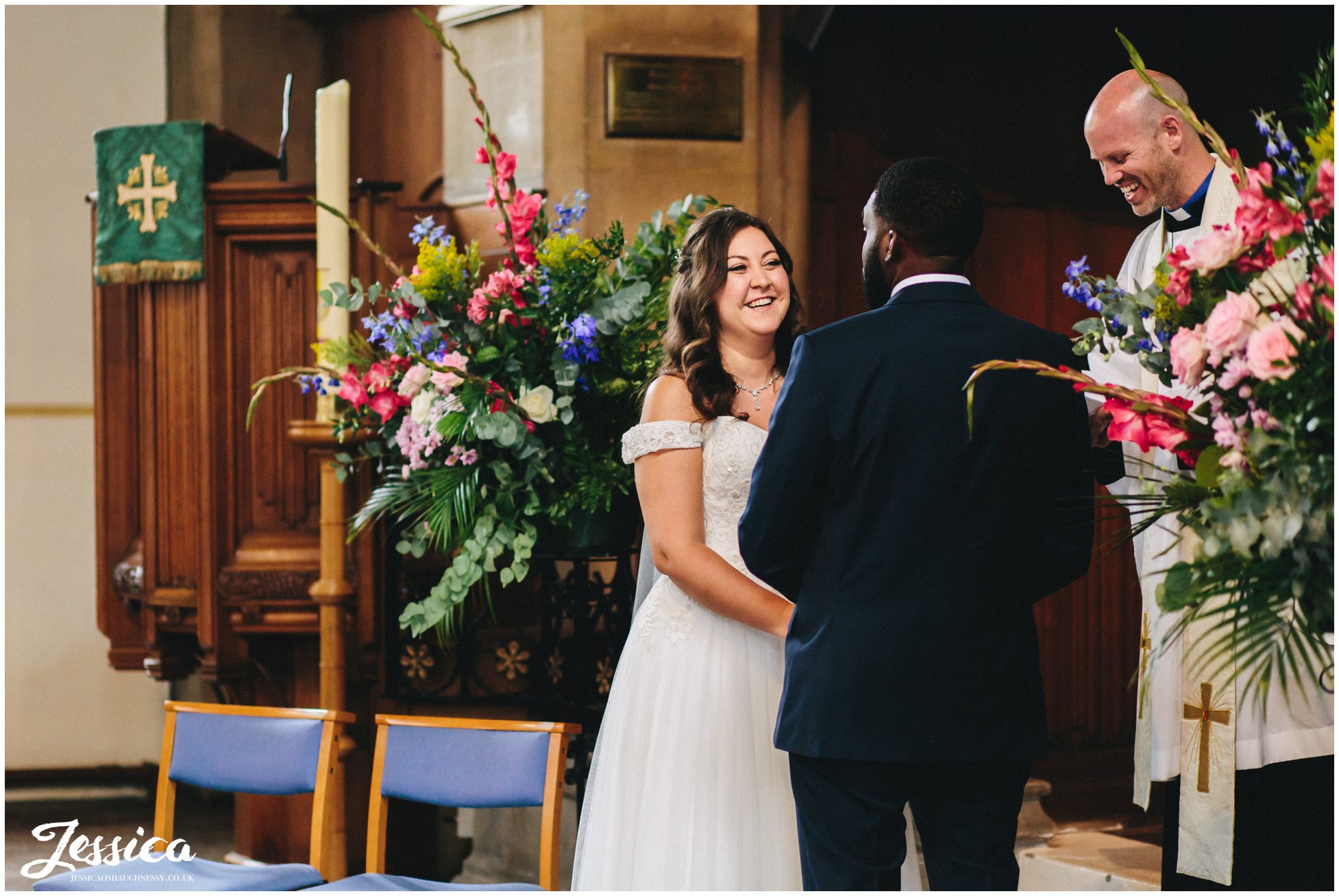 the bride laughs during their london wedding ceremony