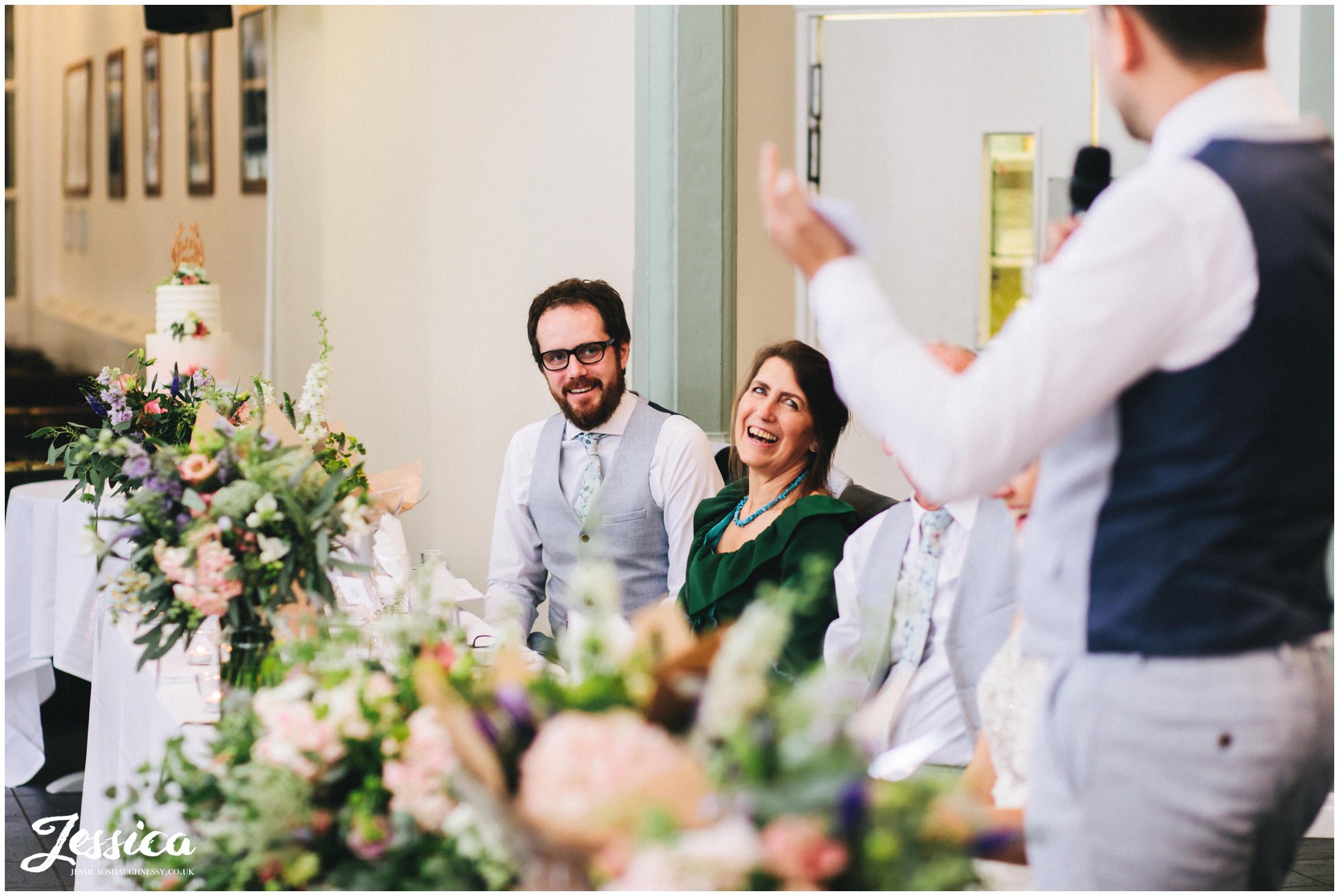 best man laughs during the grooms speech