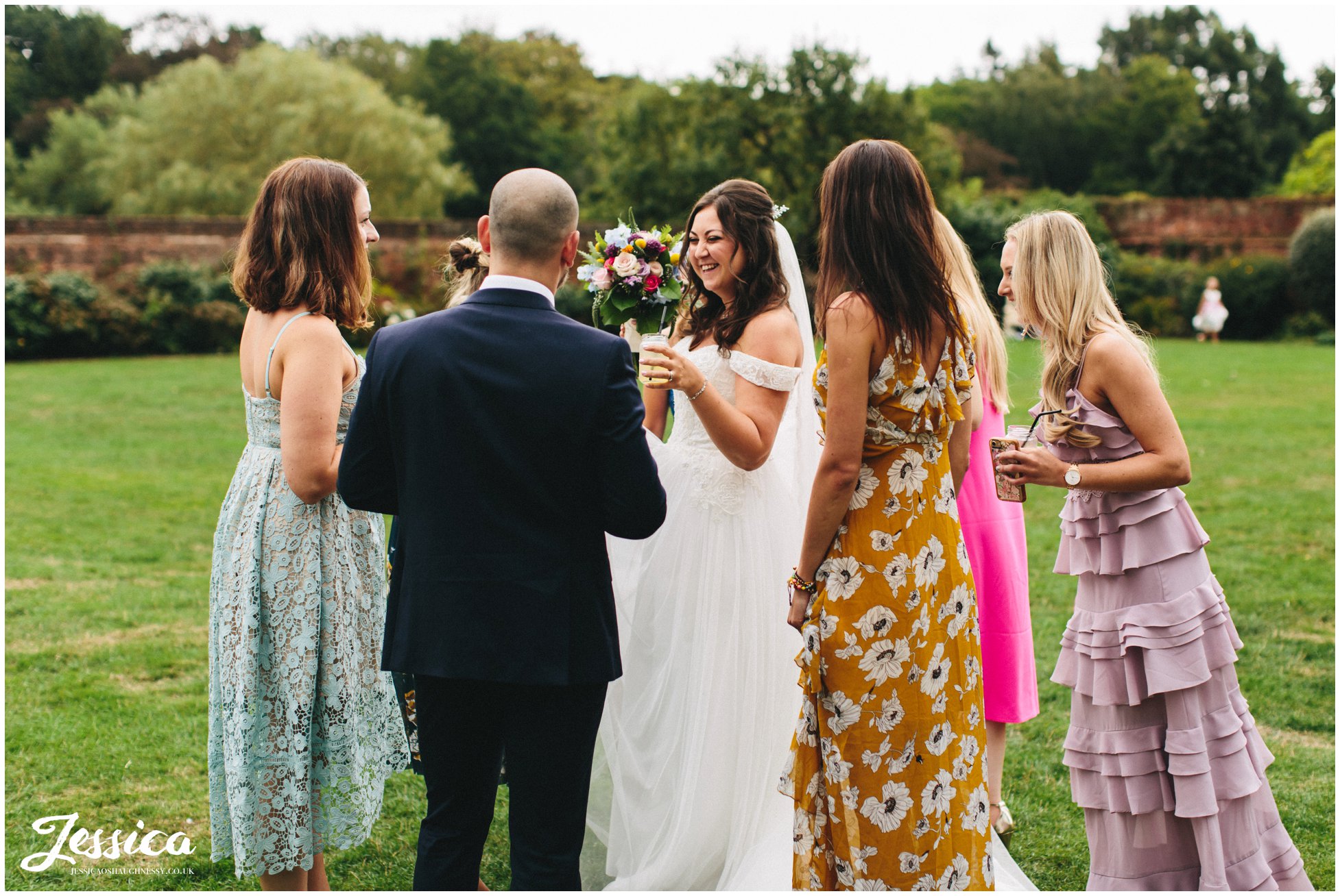 the bride laughs with her friends