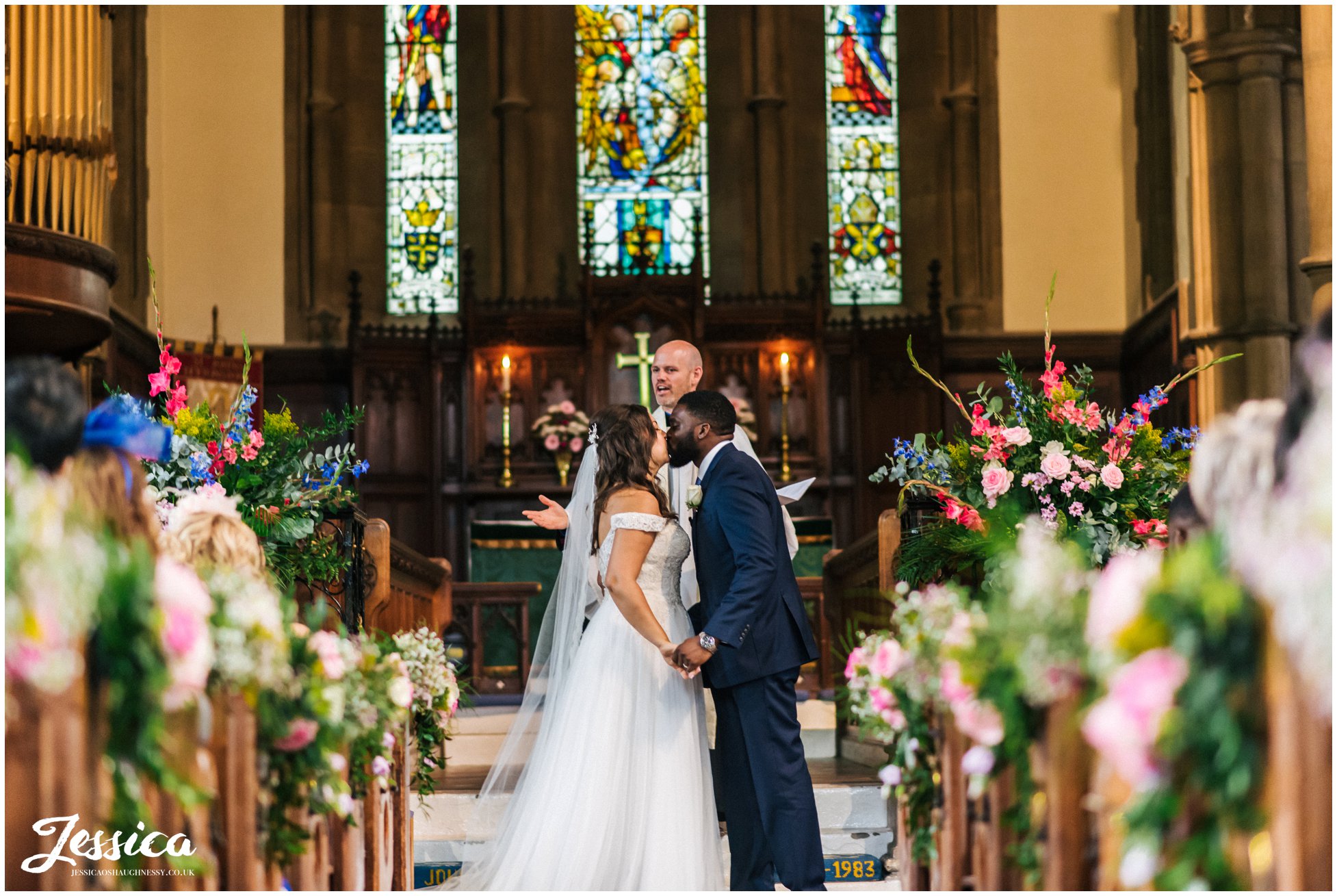 the newly wed's share their first kiss