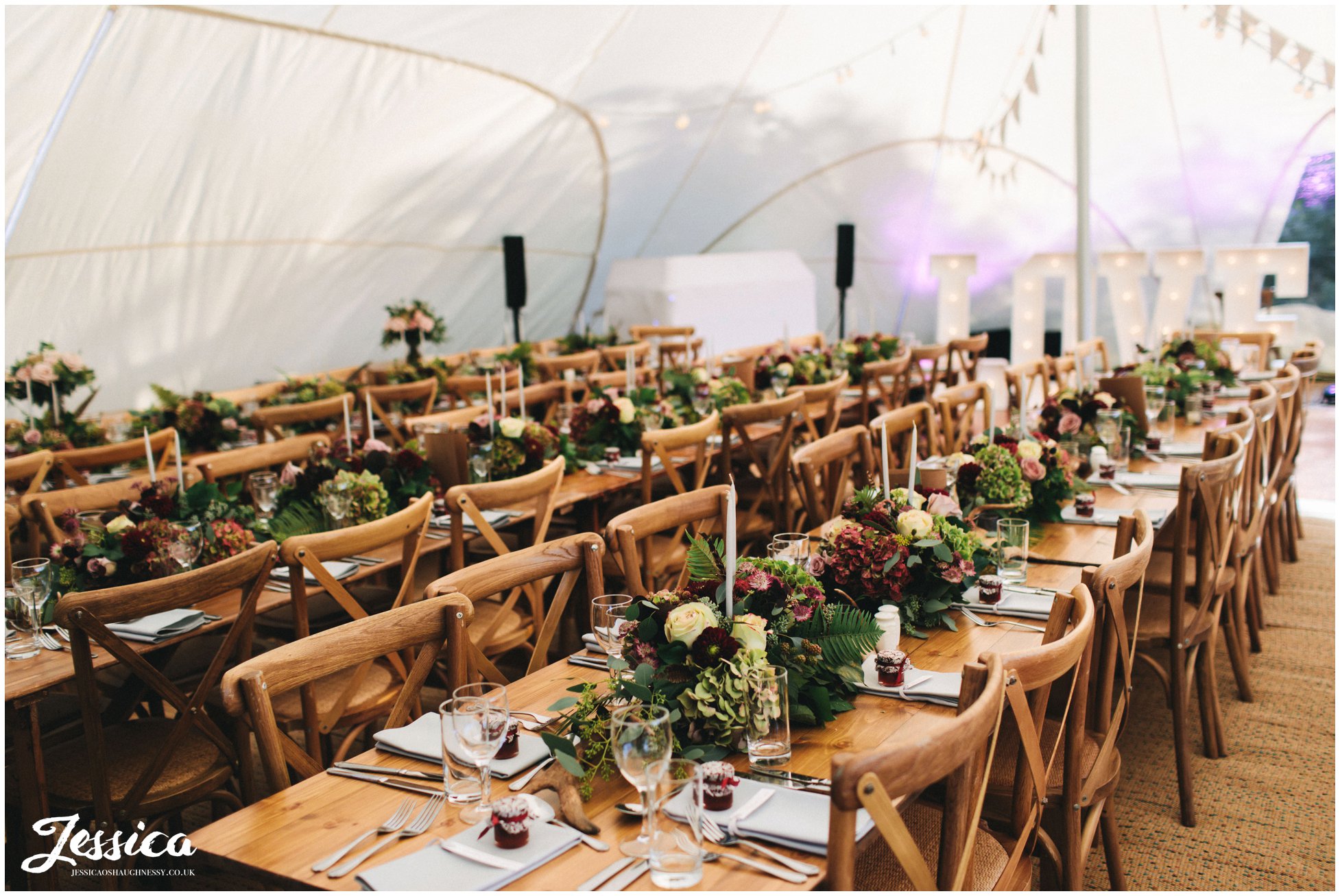flowers decorate the marquee at a diy cheshire wedding