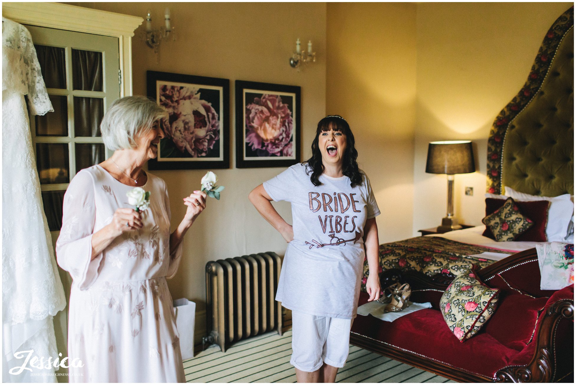 the bride laughs with her mum on the morning of her wedding