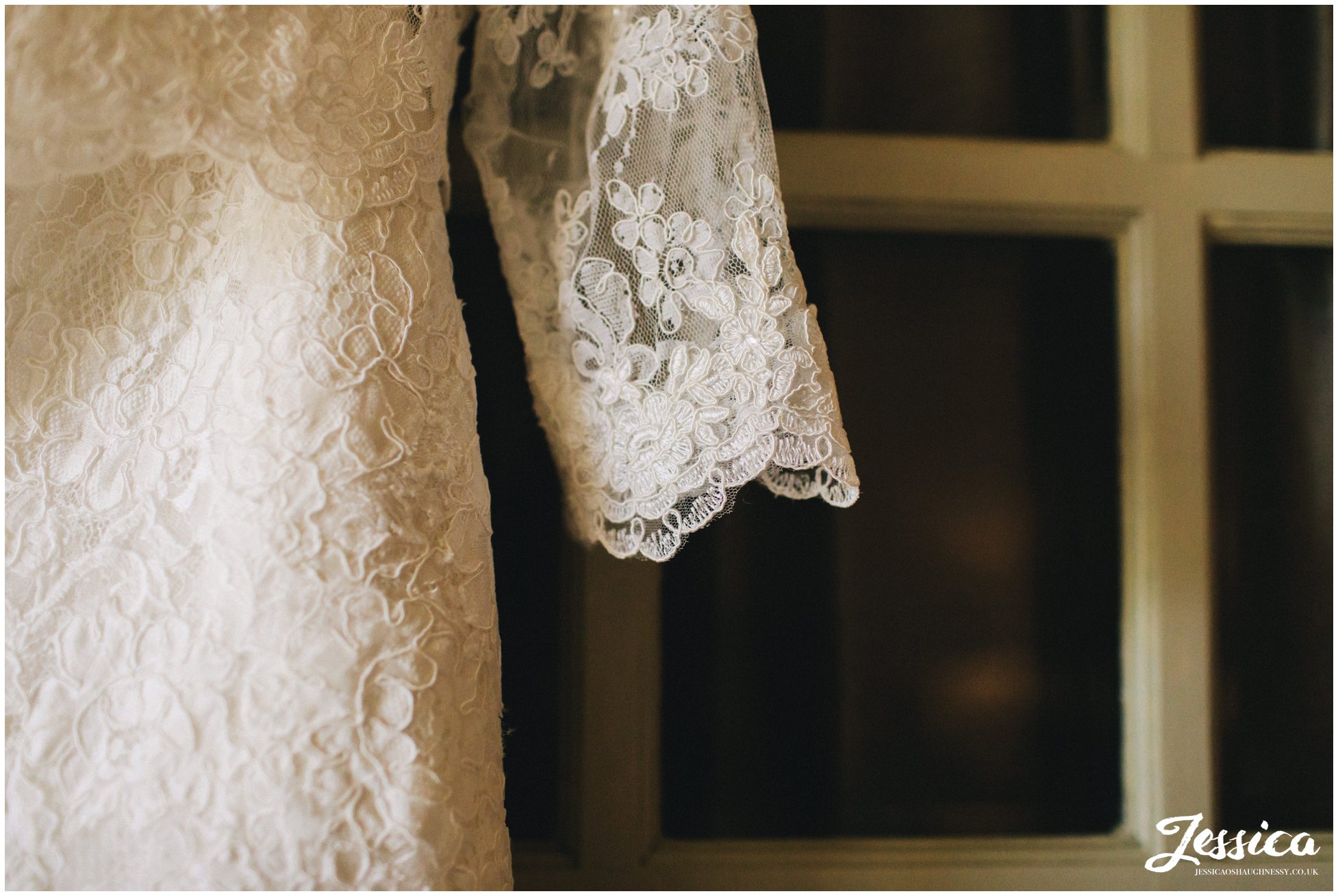 detail shot the of lace of the brides wedding dress