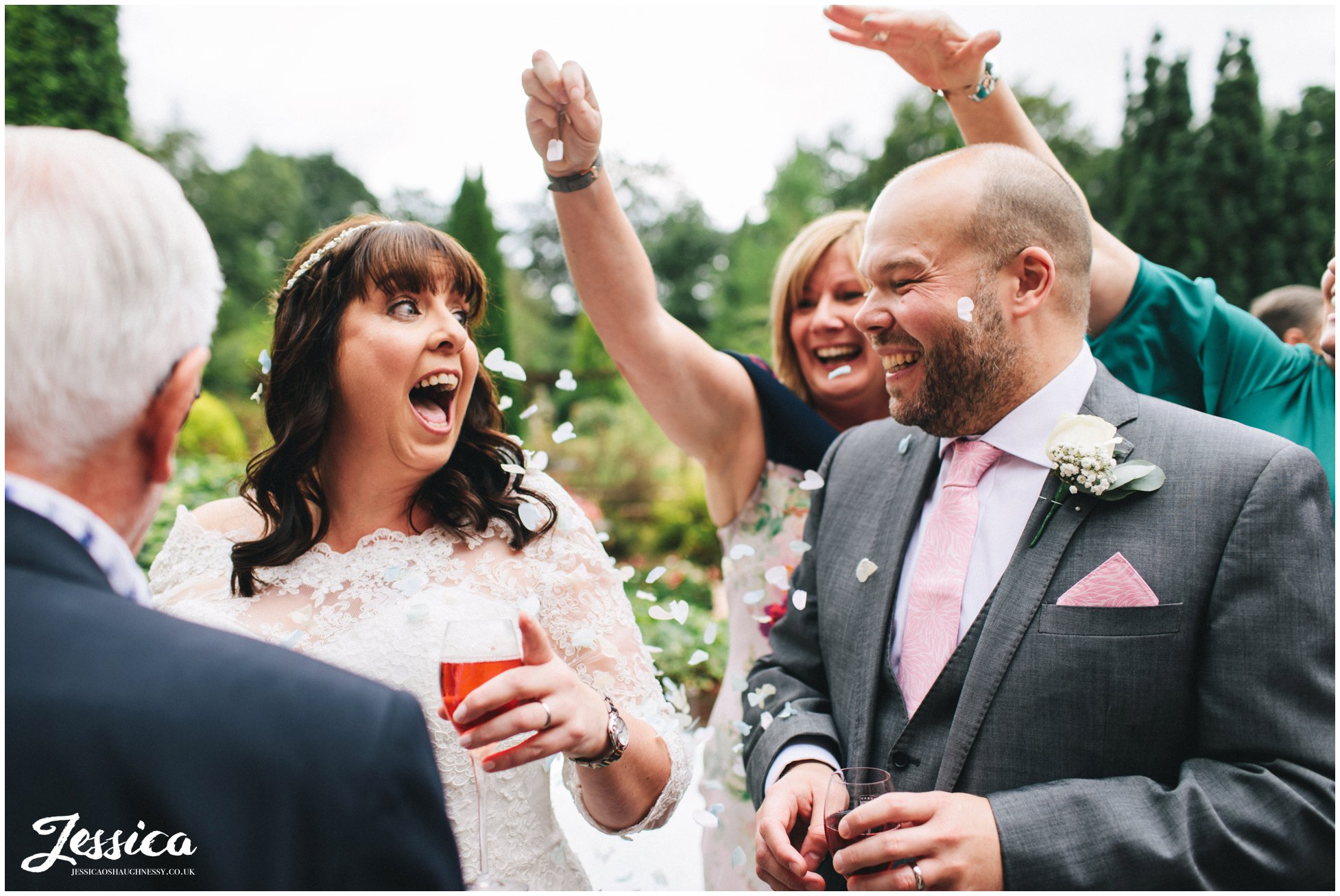 guests surprise the couple by showering them in confetti