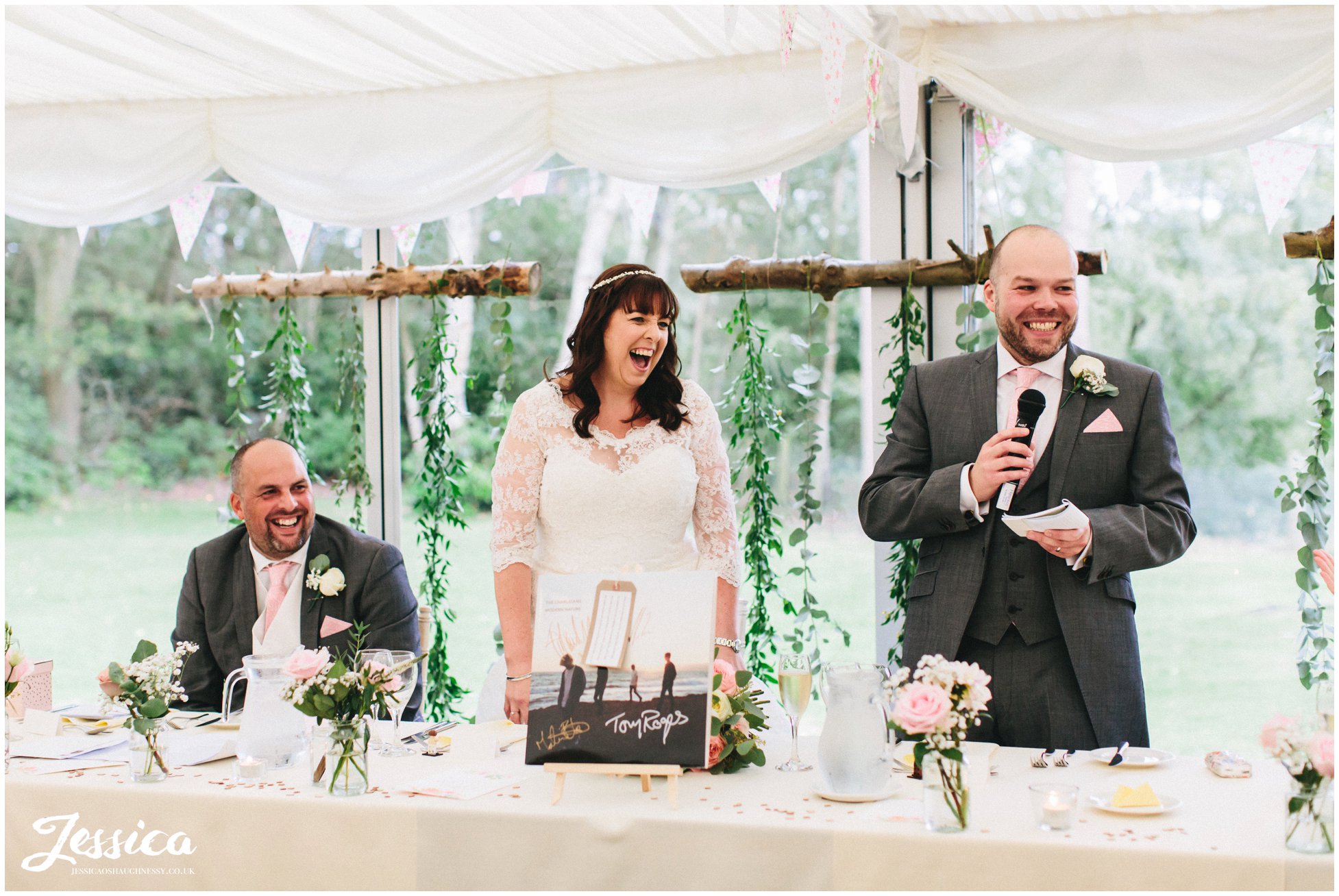 the groom stands to give his speech