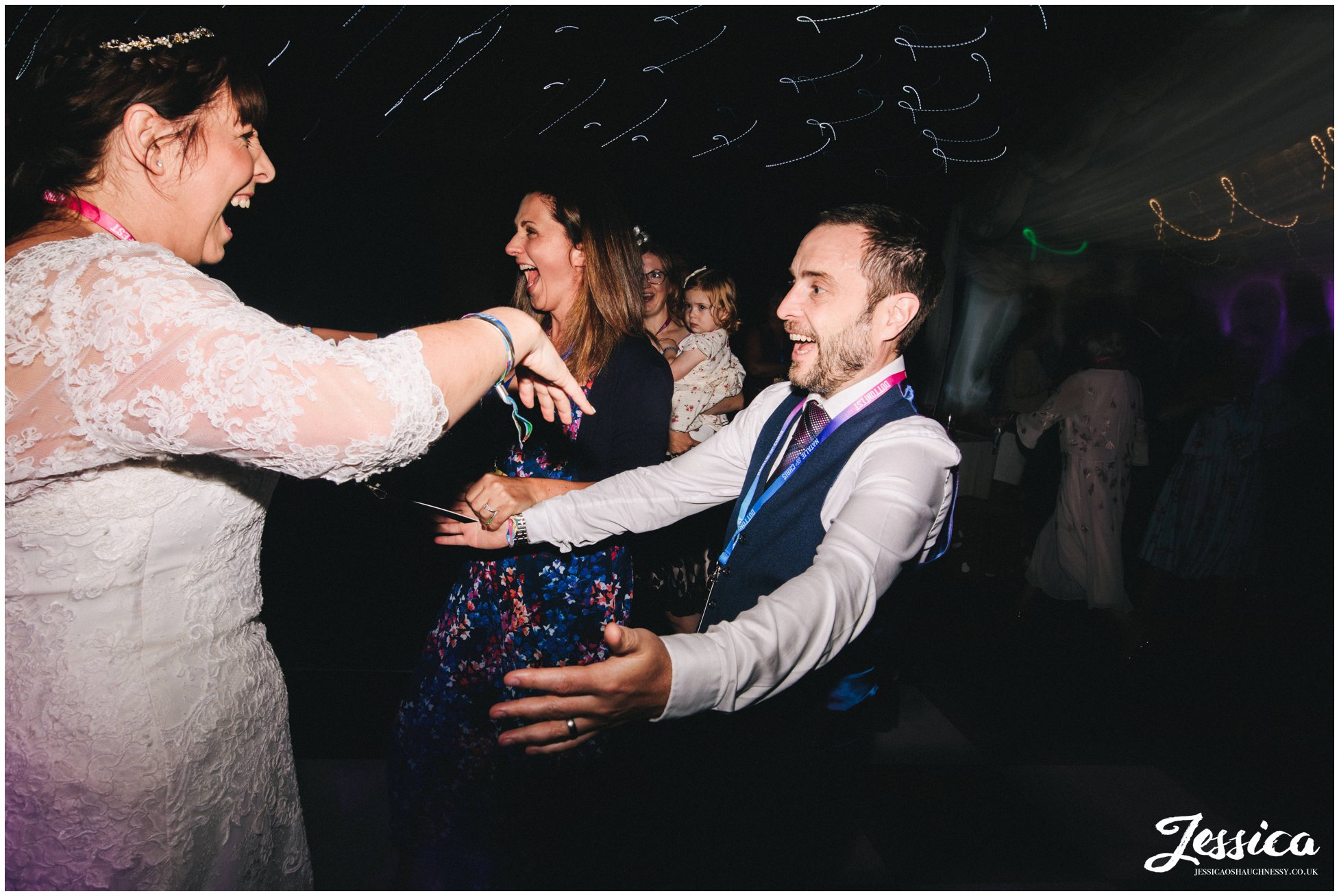 guests run on to dancefloor to join the couple