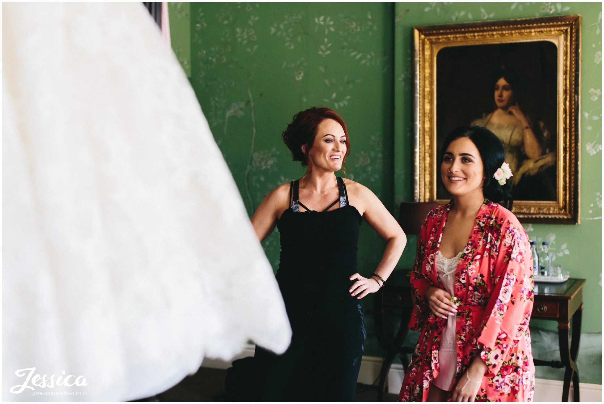 bridesmaids admire the wedding dress at stubton hall