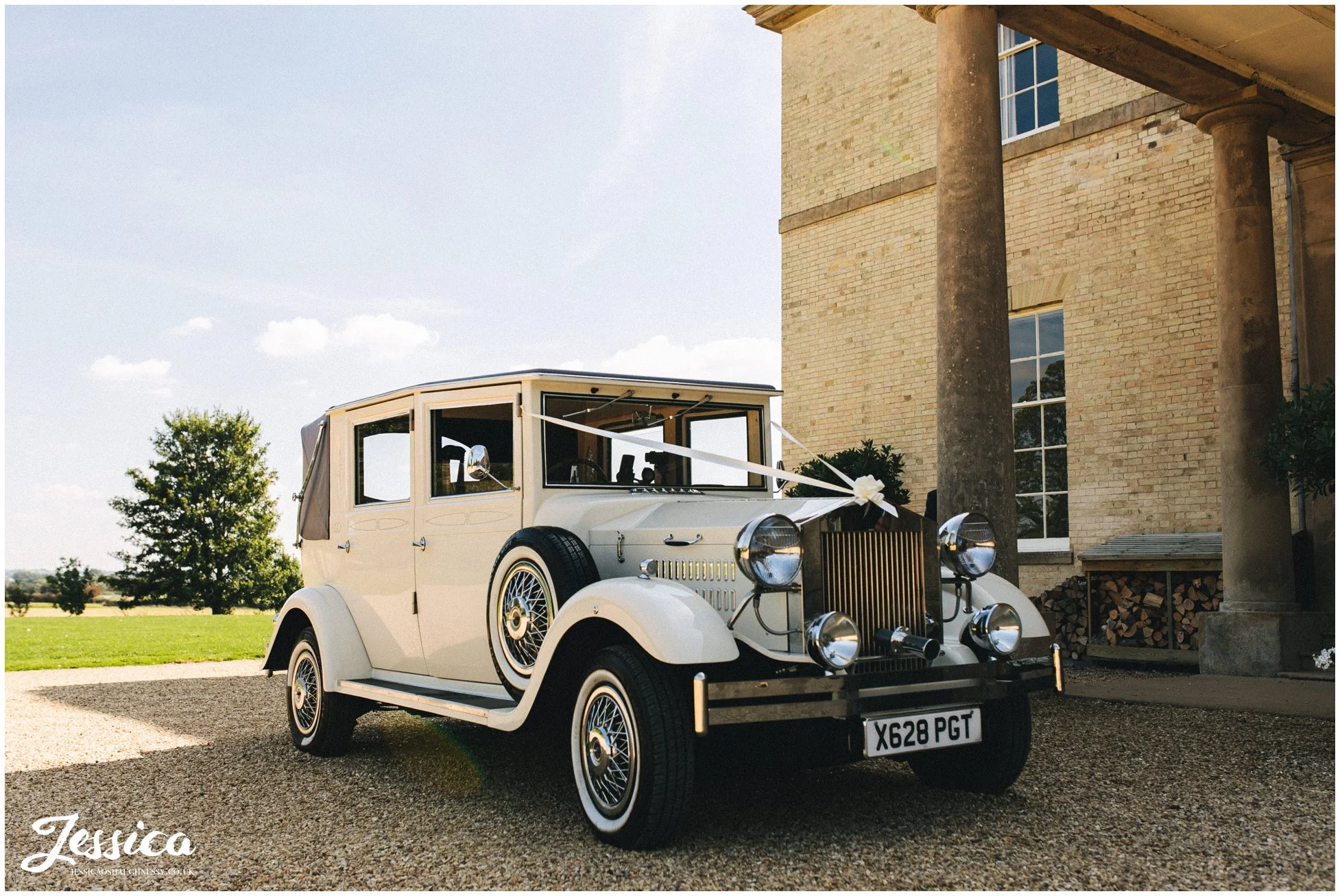 classic wedding car waits outside stubton hall for the bride