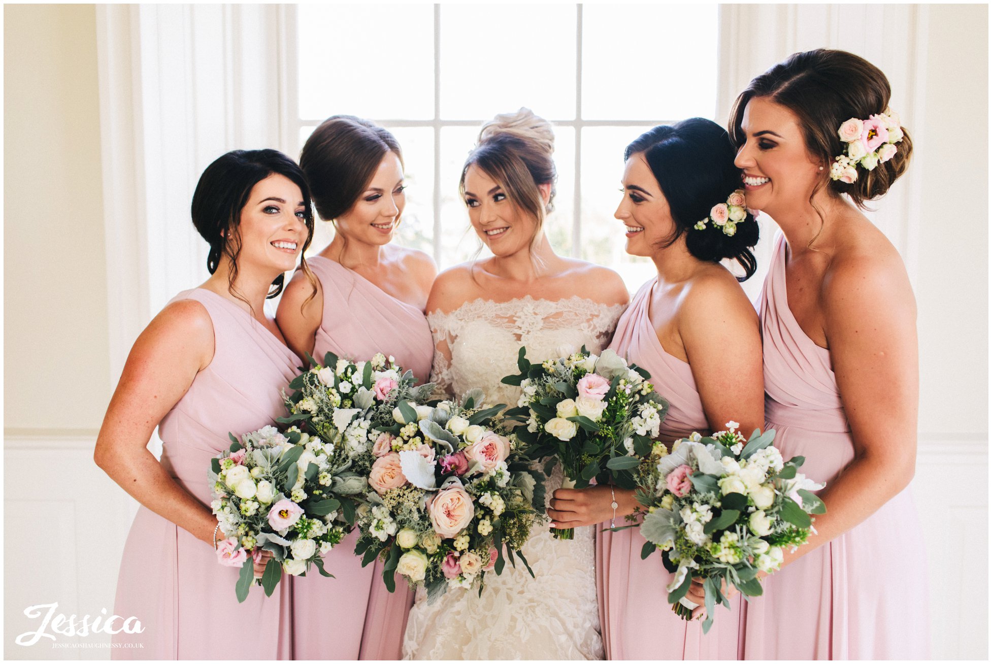 the bride & her bridesmaids in the music room