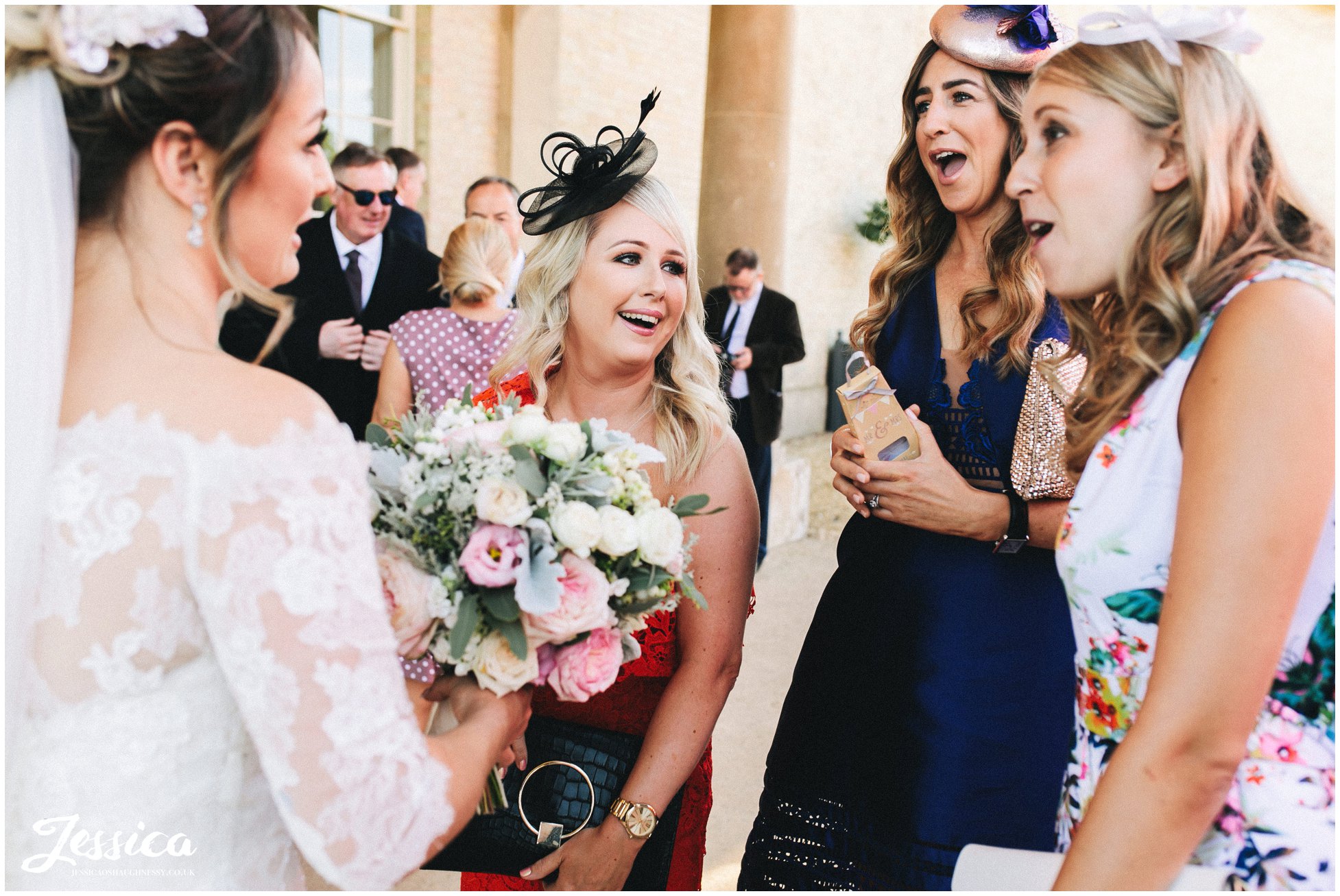 the brides friends laugh with her 