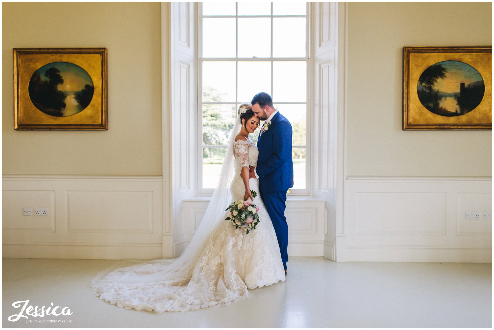 the couple hold each other in stubton hall's music room
