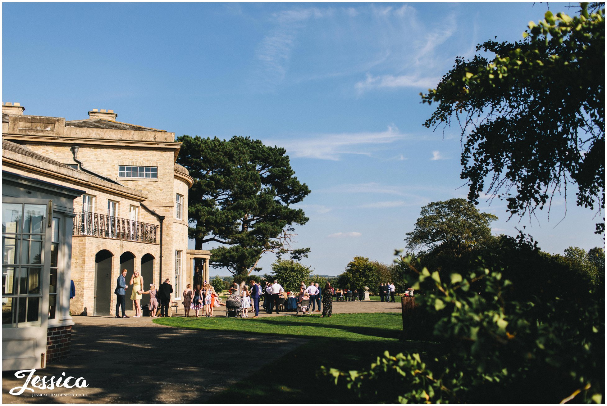 guests enjoy the weather at stubton hall champagne reception