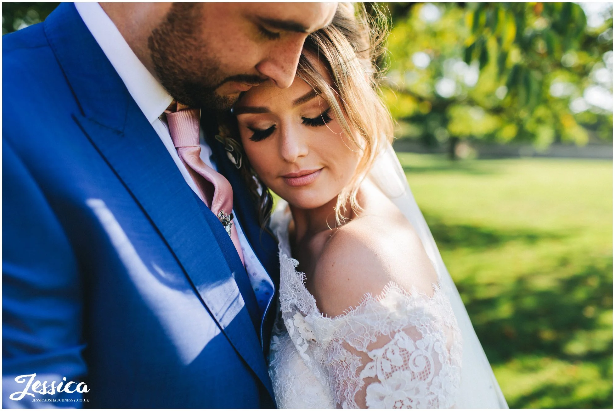 close up of the bride hugging the groom