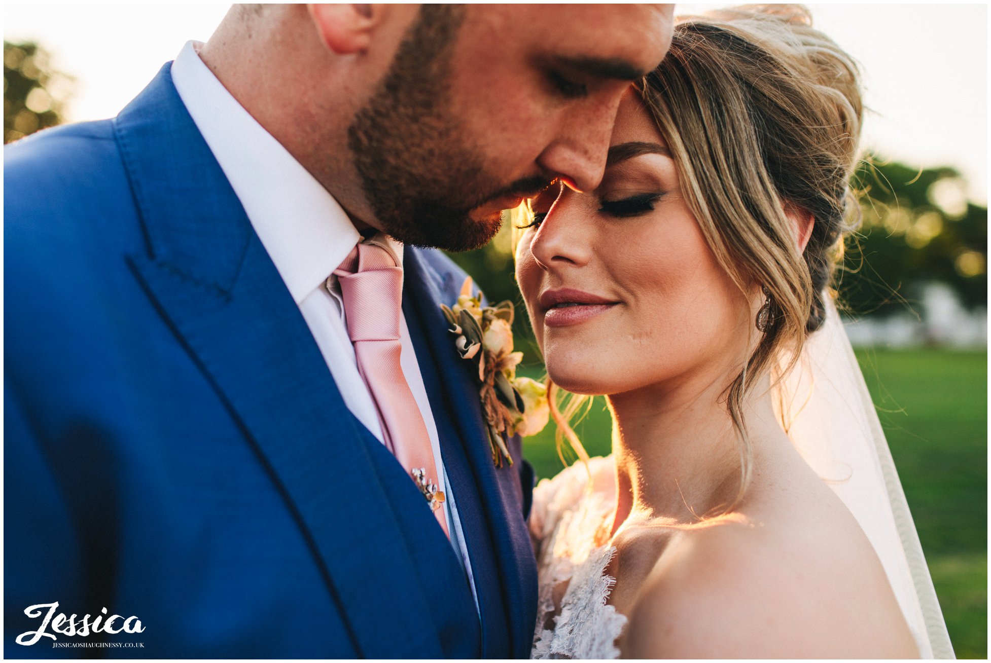 close up of the bride & groom sharing an intimate moment