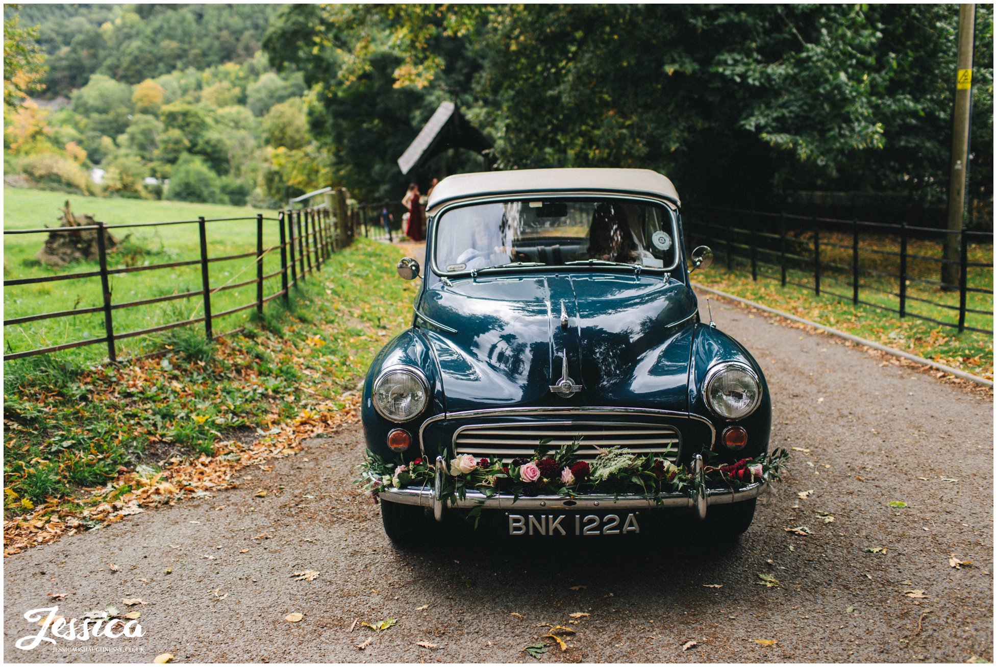 the bride arrives in a vintage car