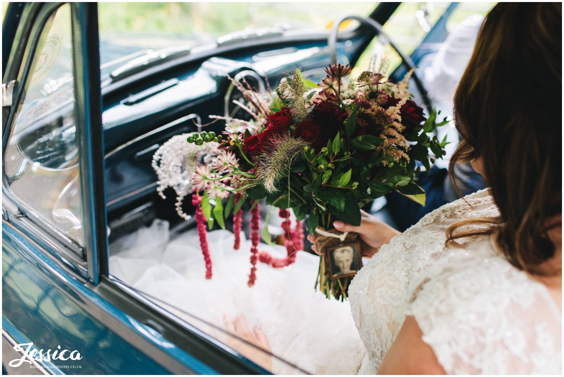 the bride holds her rustic bouquet