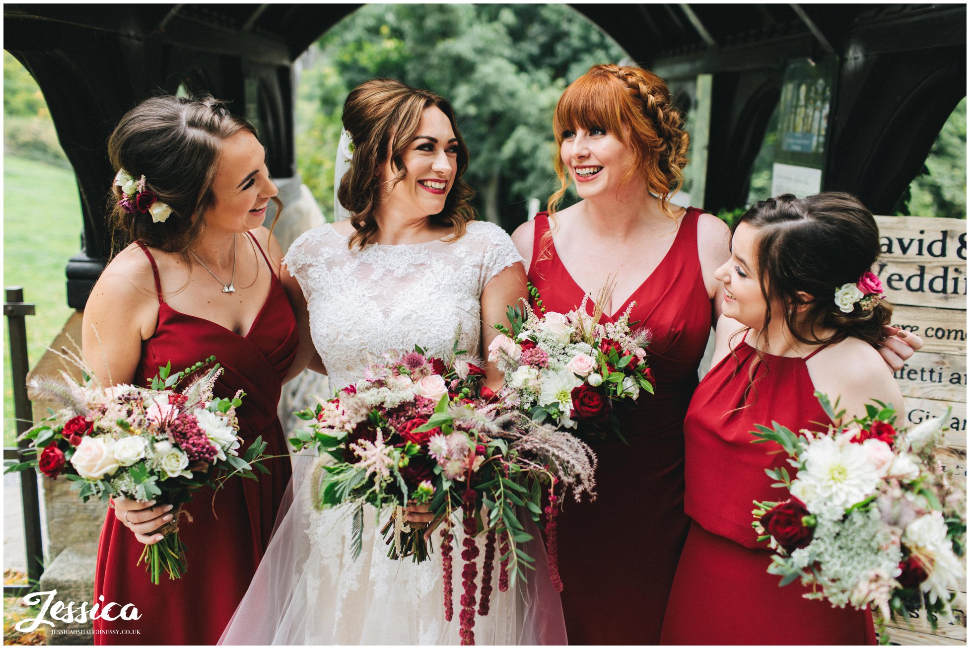the bride laughs with her bridesmaids before the ceremony starts
