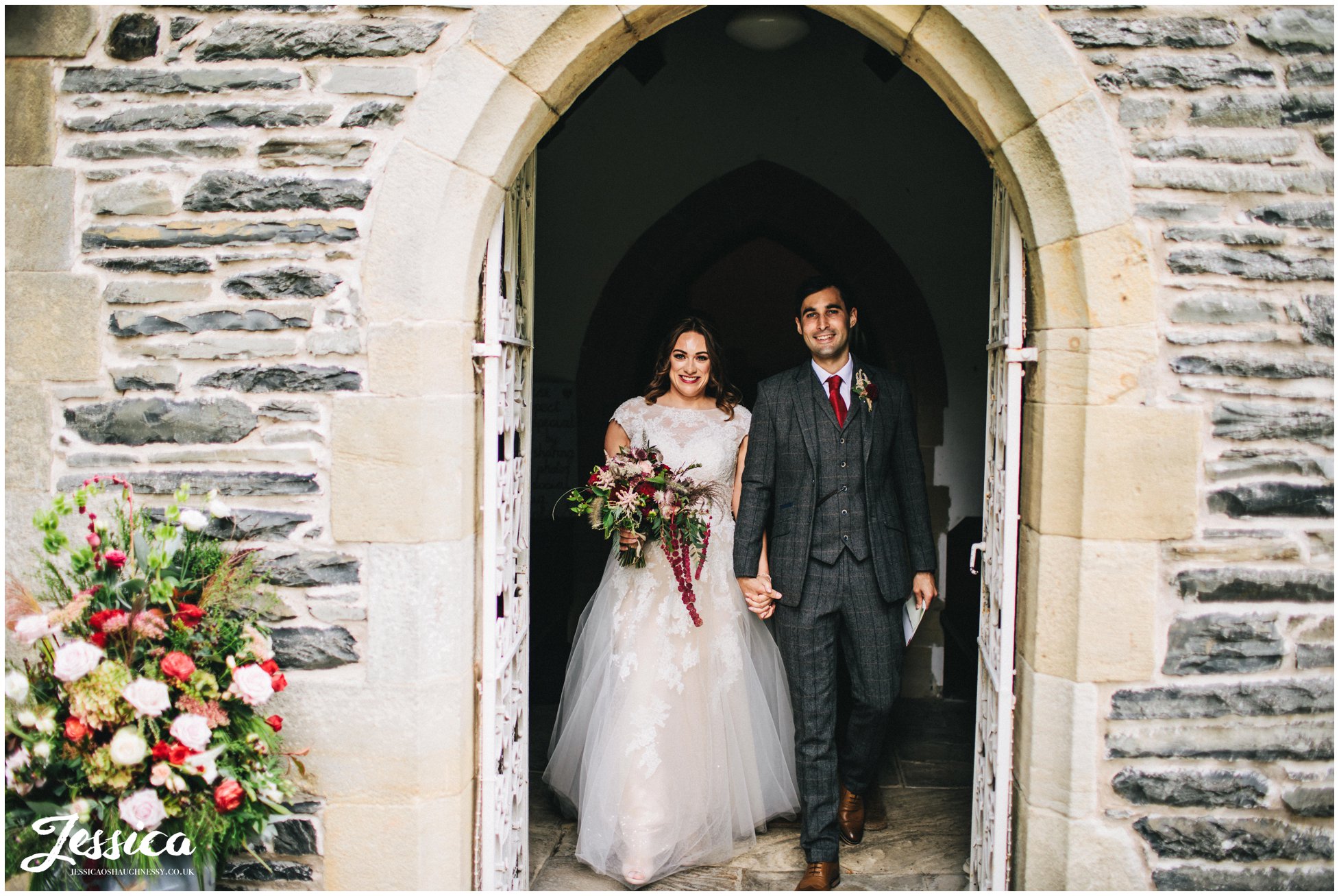 the couple exit Llantysilio church in north wales