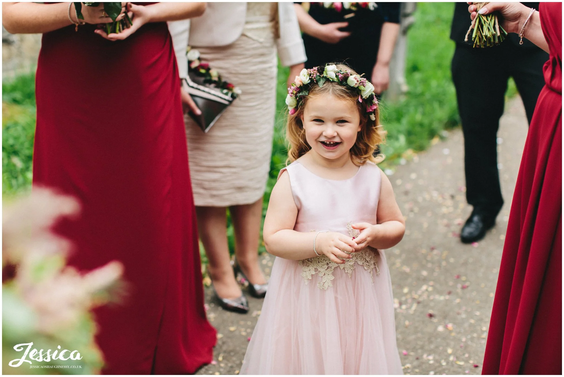 flower girl stood outside the church