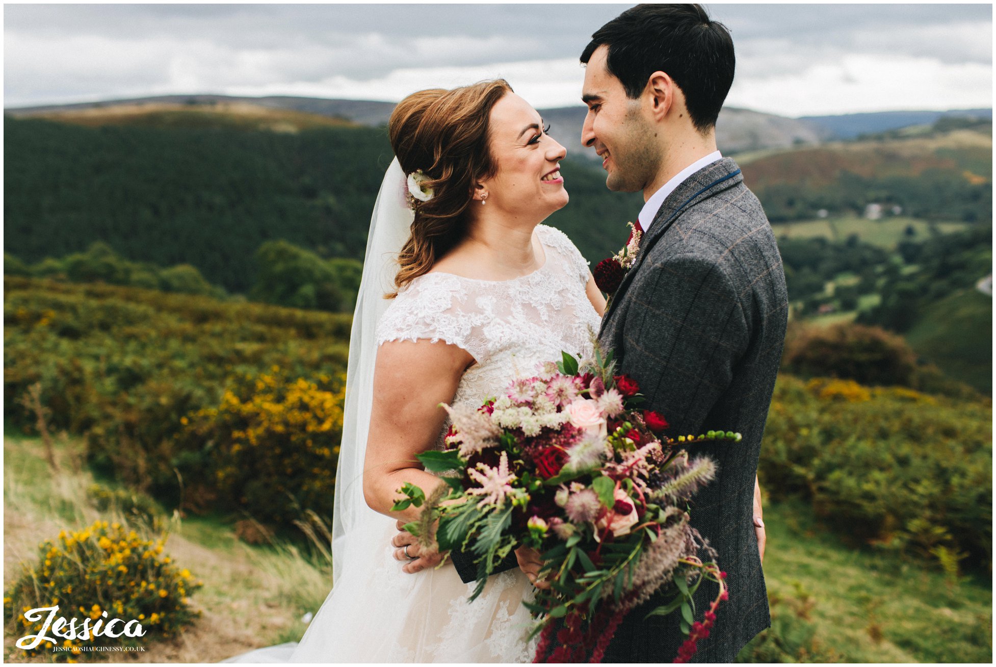 bride and groom have their photographs taken in picturesque north wales area