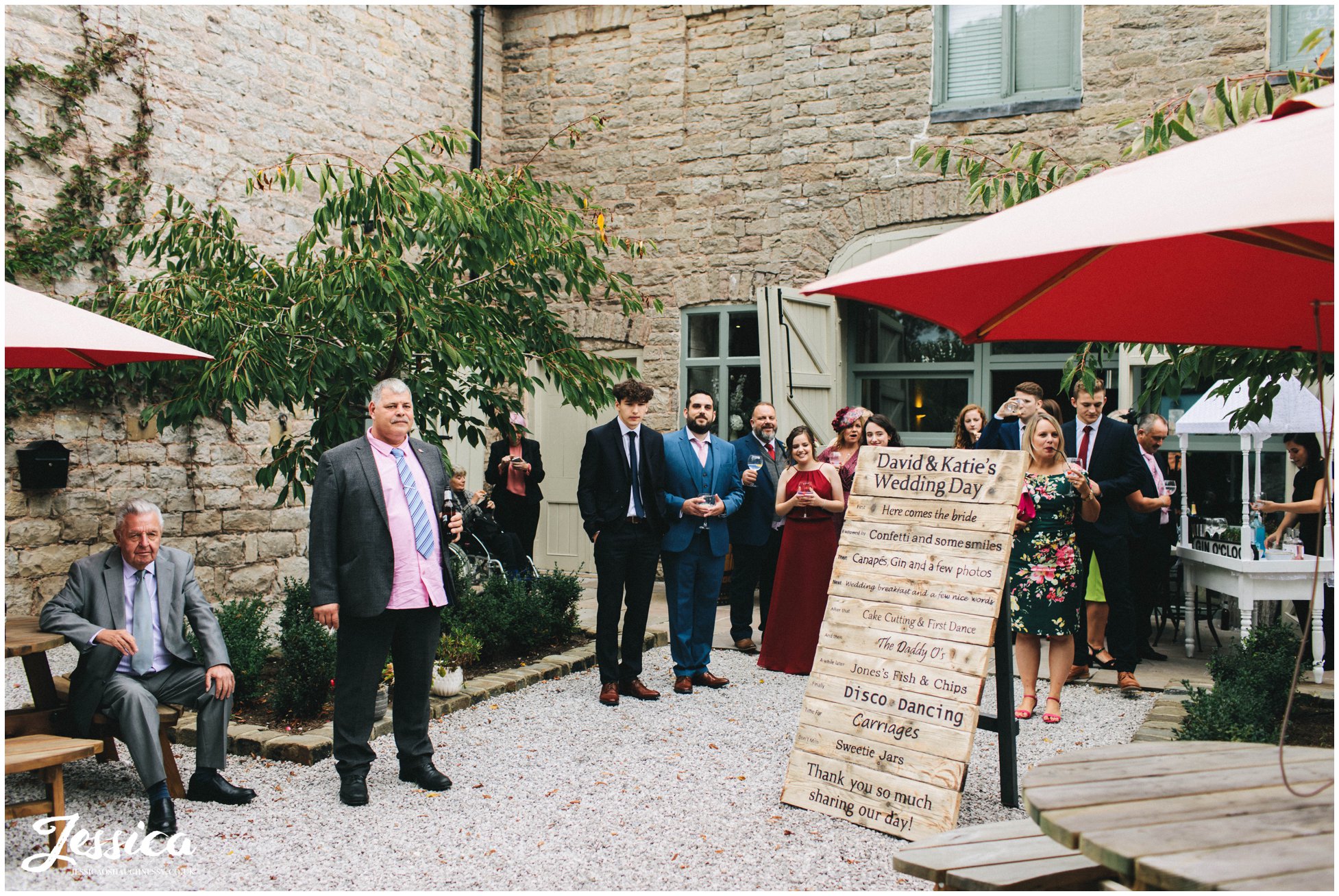 guests await the arrival of the new couple