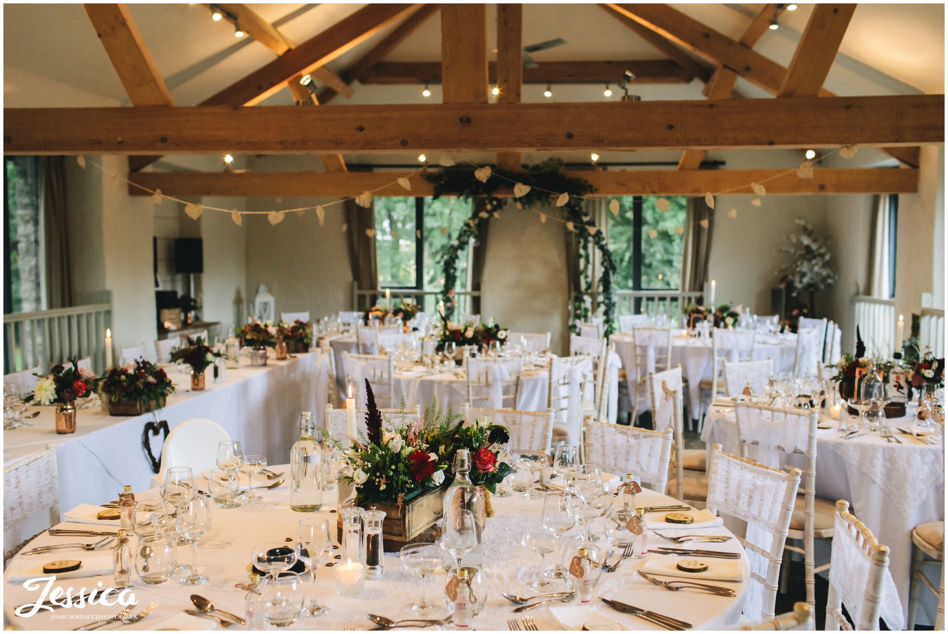 Llanrhaeadr Springs decorated in rustic flowers and gin bottles