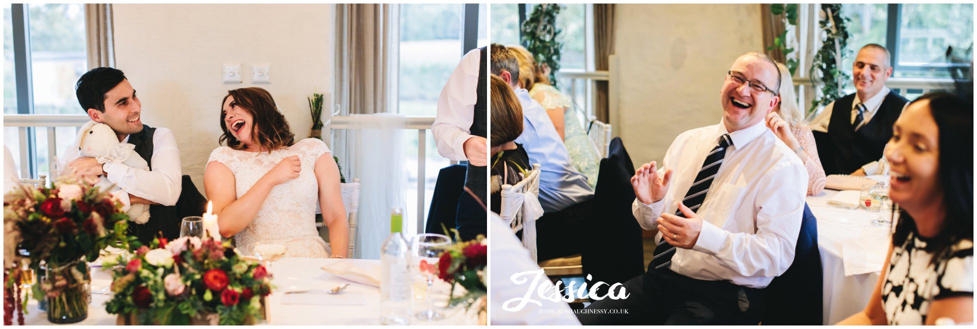 the couple and guests laughing during the wedding breakfast