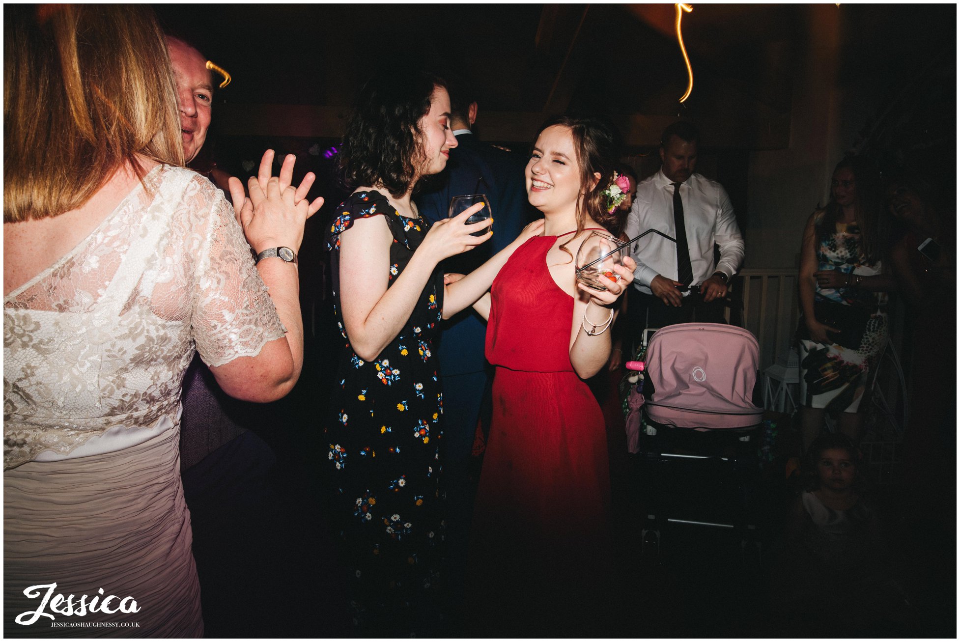 guests join the couple on the dancefloor at Llanrhaeadr Springs
