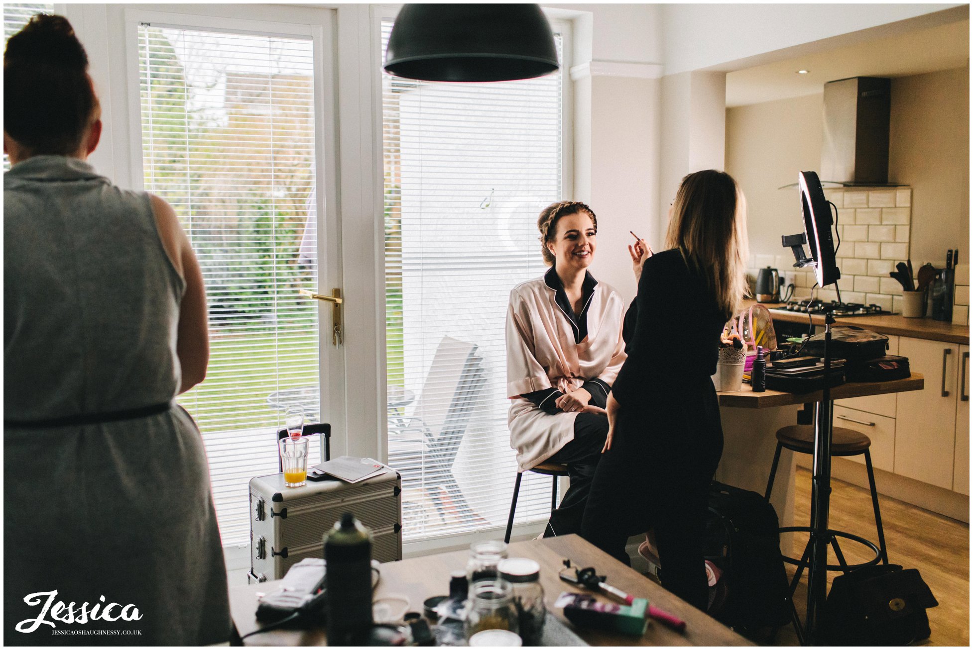 the maid of honour gets her makeup done