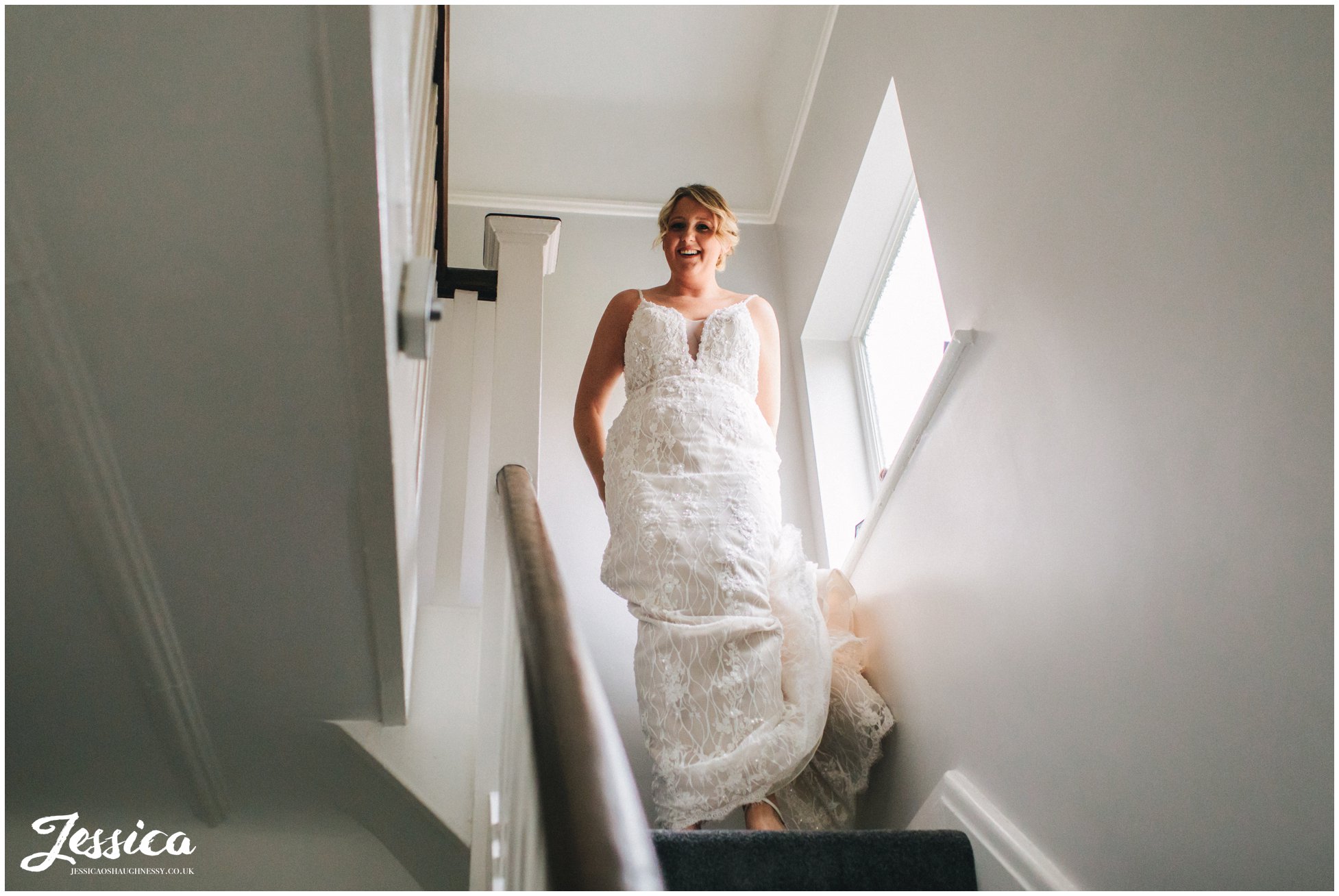 the bride comes downstairs dressed and ready to go