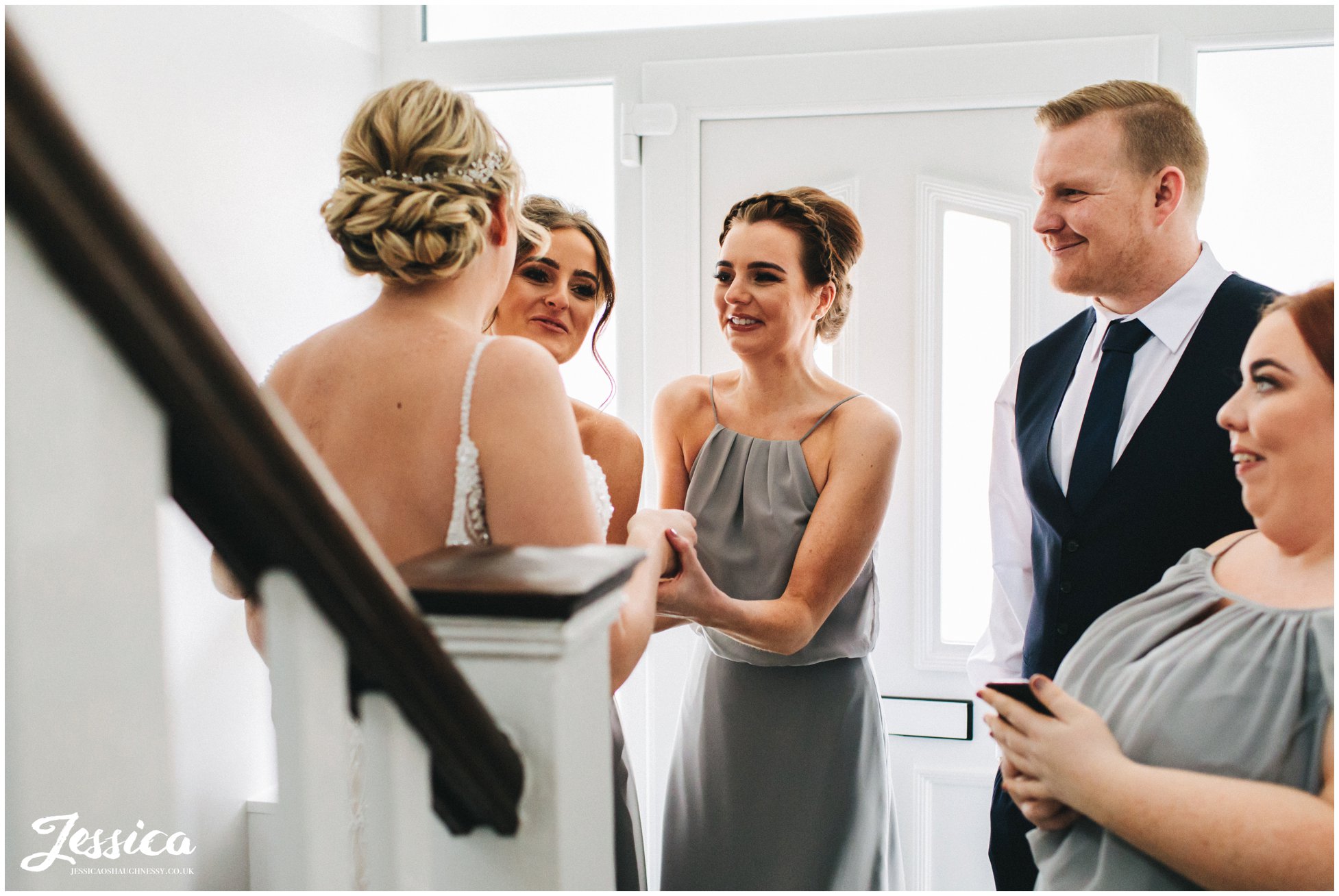 the bridal party get emotional seeing the bride in her dress