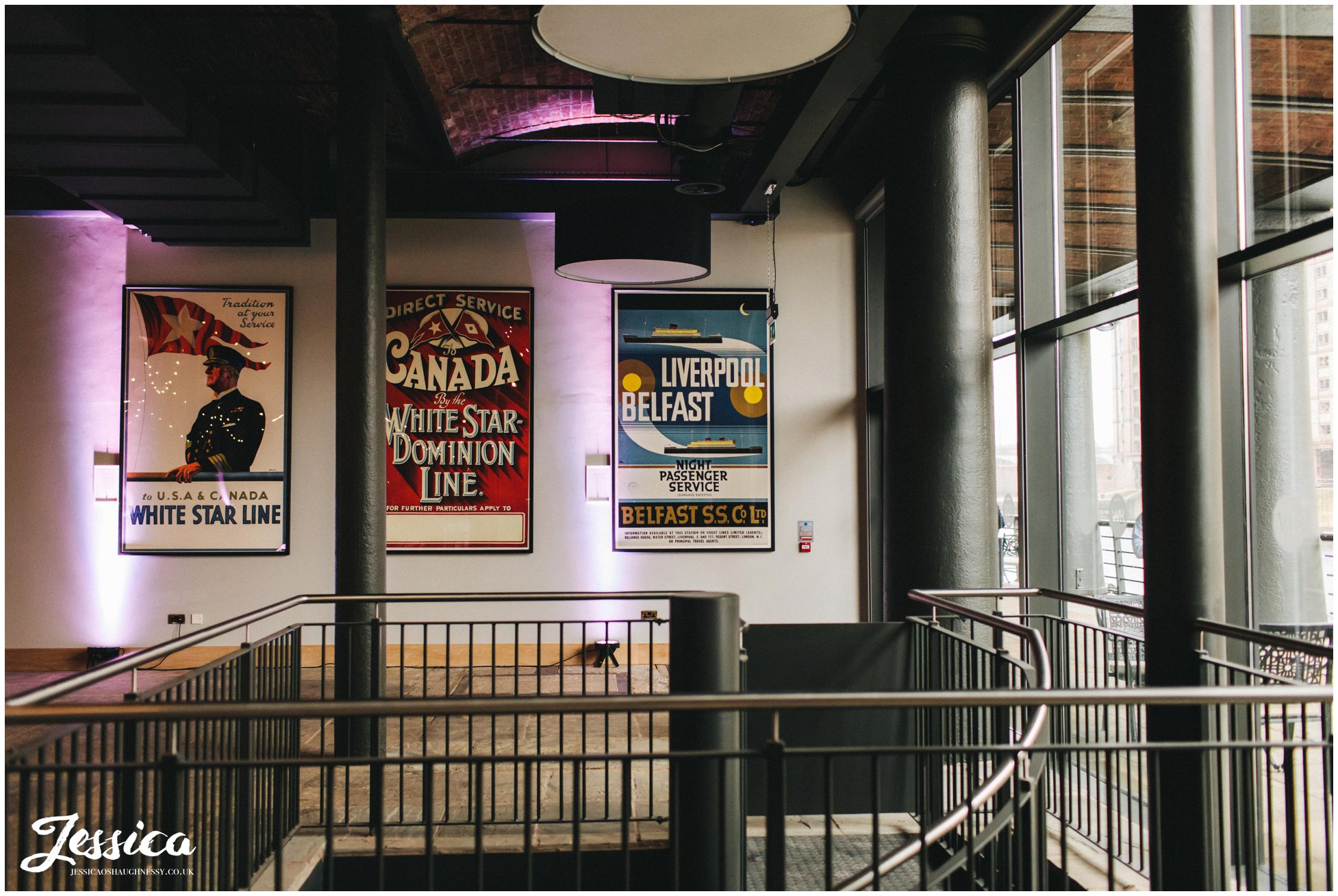 vintage titanic posters decorate the liverpool wedding venue