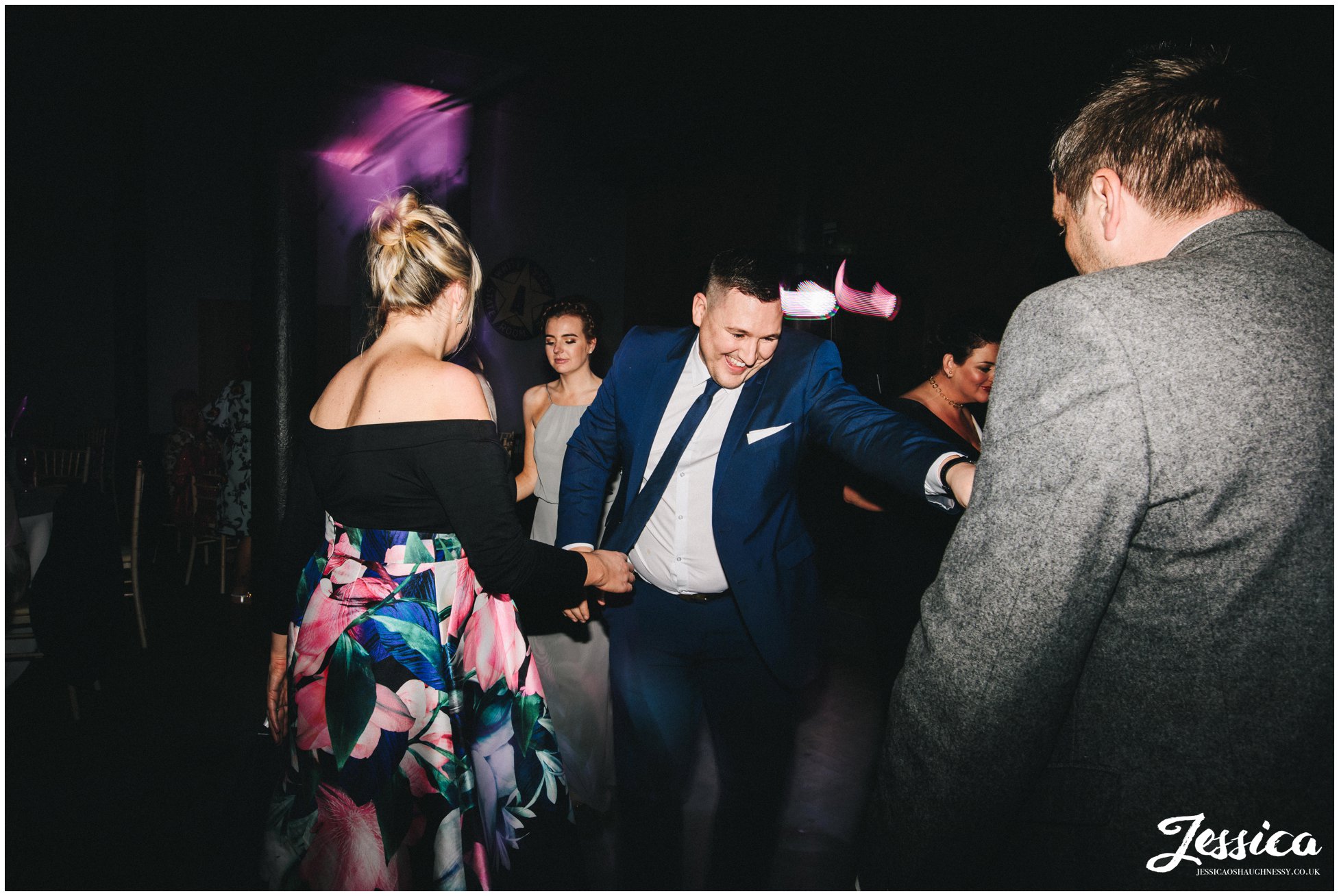 friends of the couple dance on the dancefloor