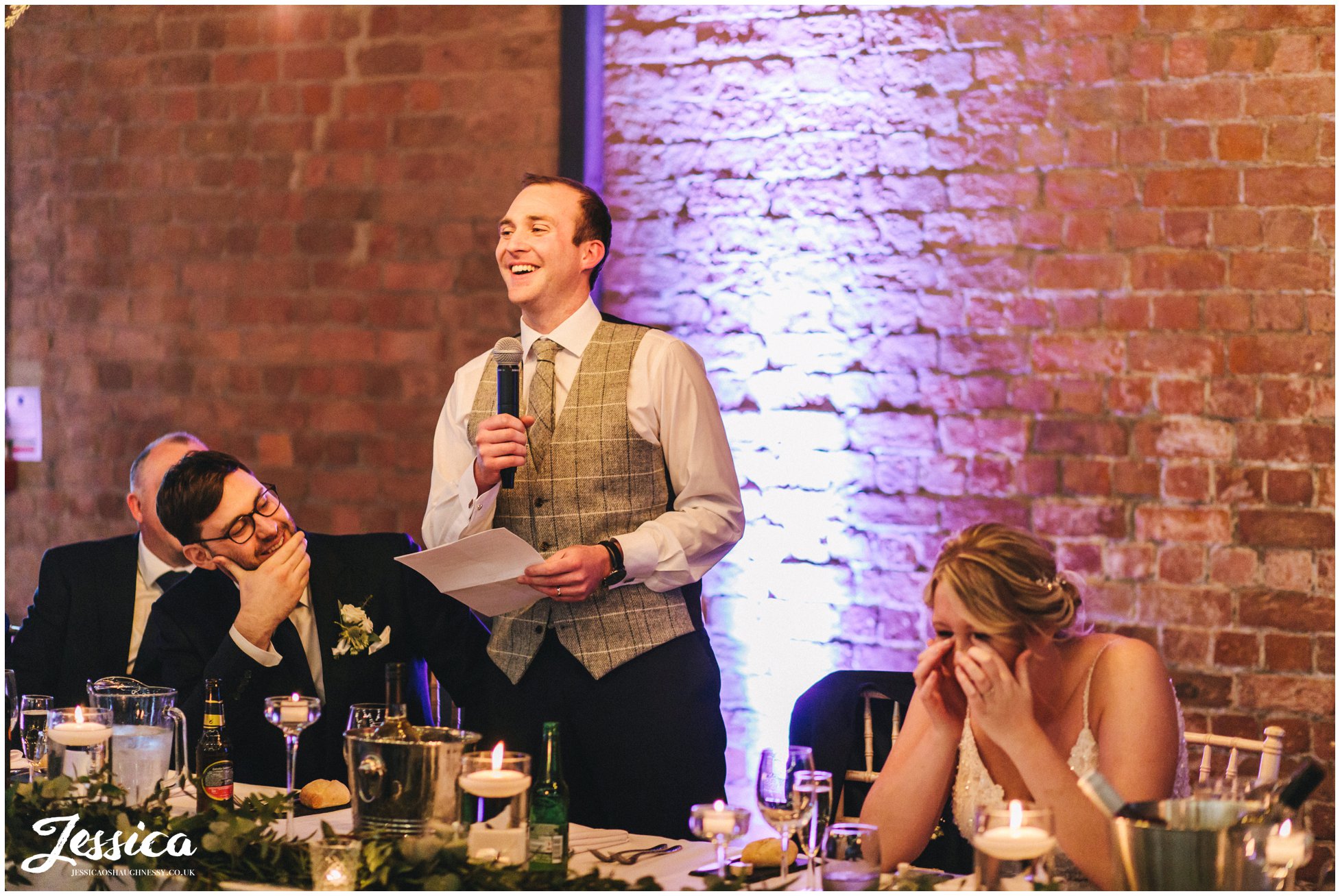 the groom stands to give his speech