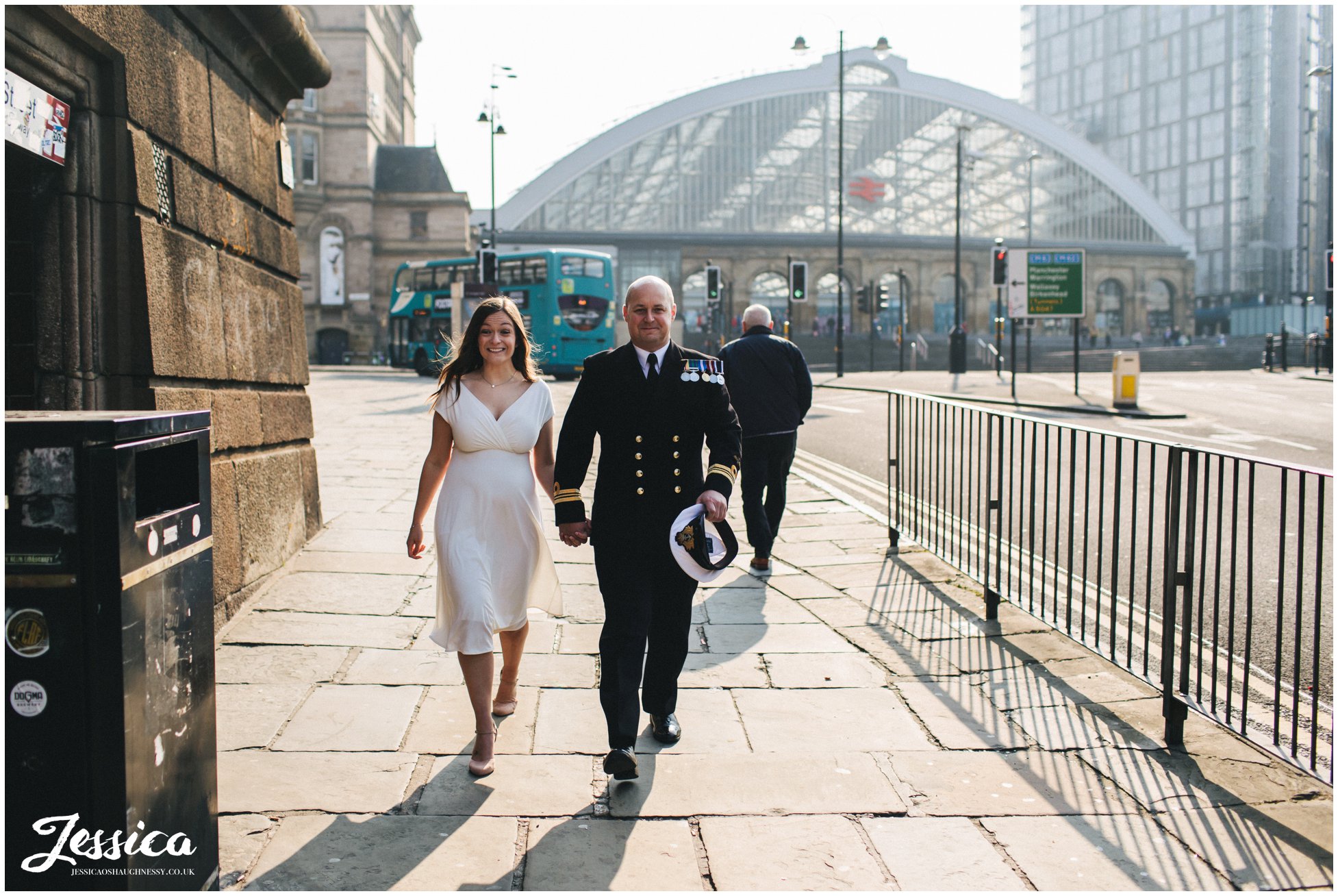 bride &amp; groom walk into st georges hall in liverpool for their elopement ceremony