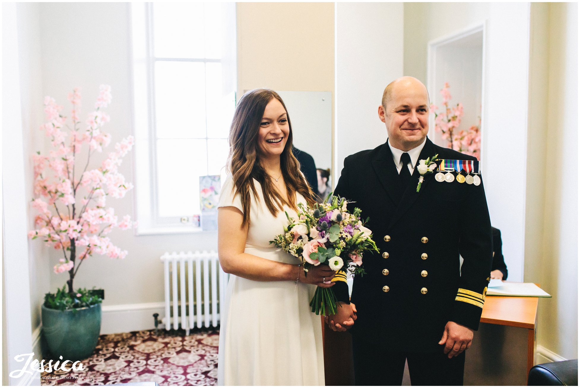 the couple say their vows in st georges hall in liverpool