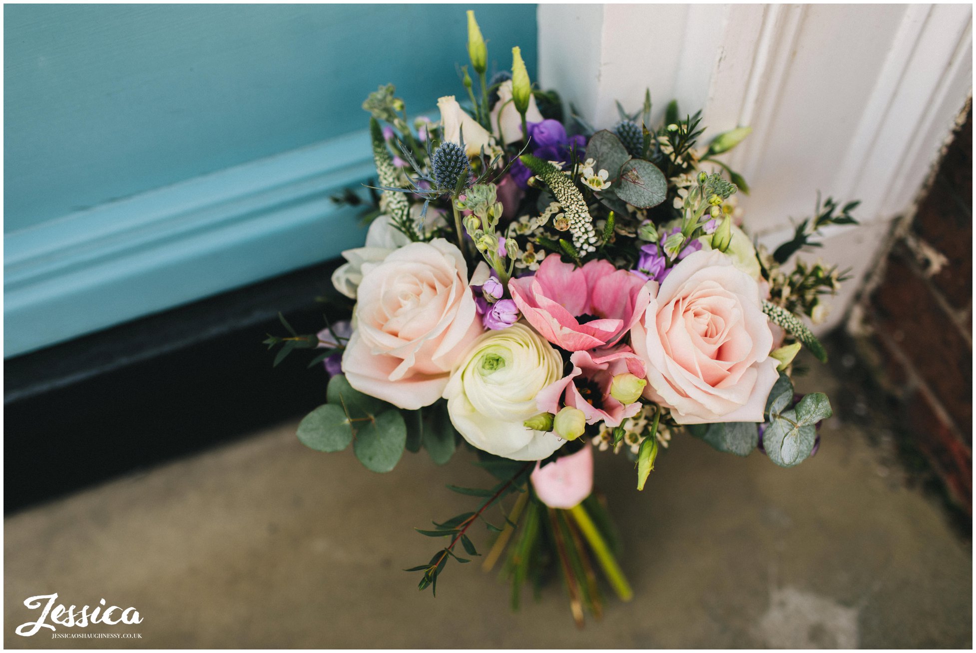 boho bouquet propped against colourful doors in hope street, liverpool