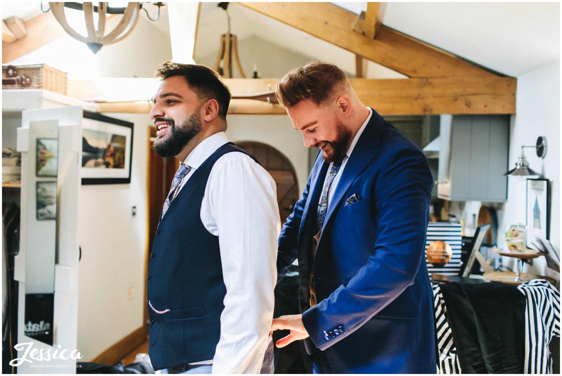 the grooms get ready together ahead of their lake district wedding