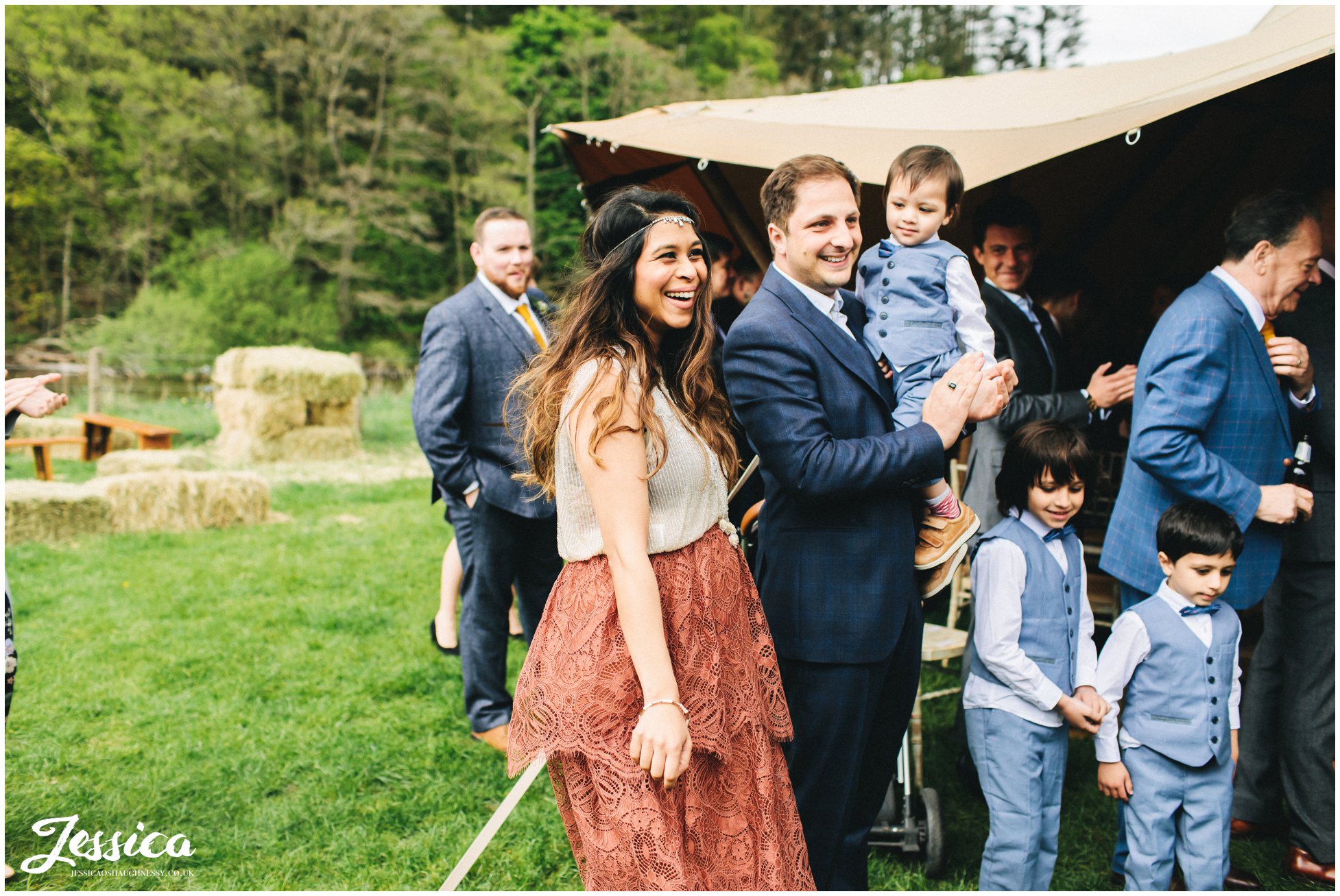 guests cheer as the couple exit