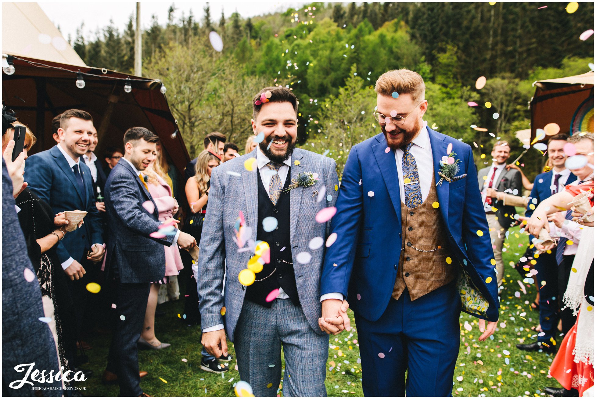 groom & groom walk through their confetti line