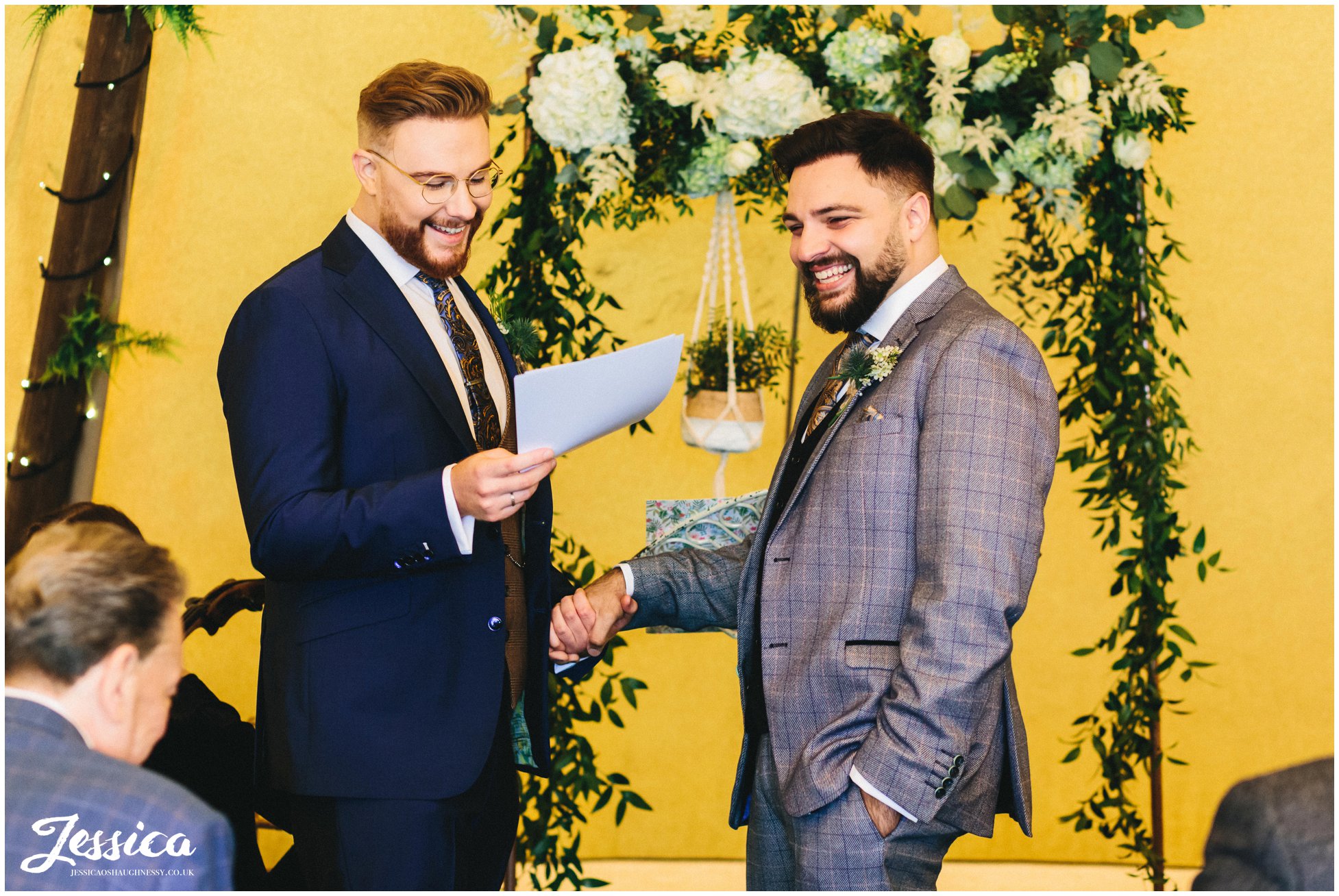 Grooms laugh whilst delivering their speeches