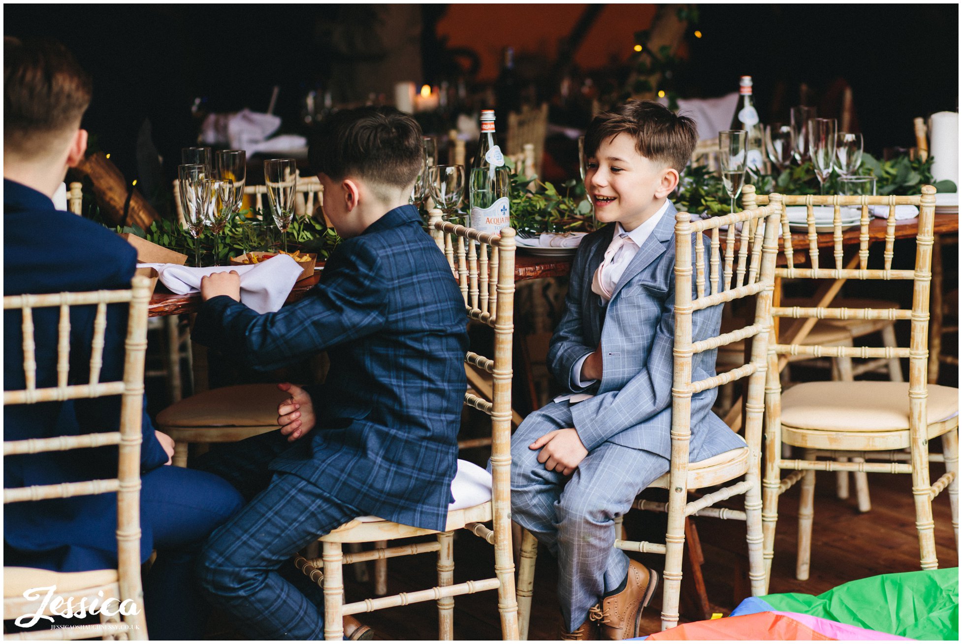 boys laughing during their wedding breakfast