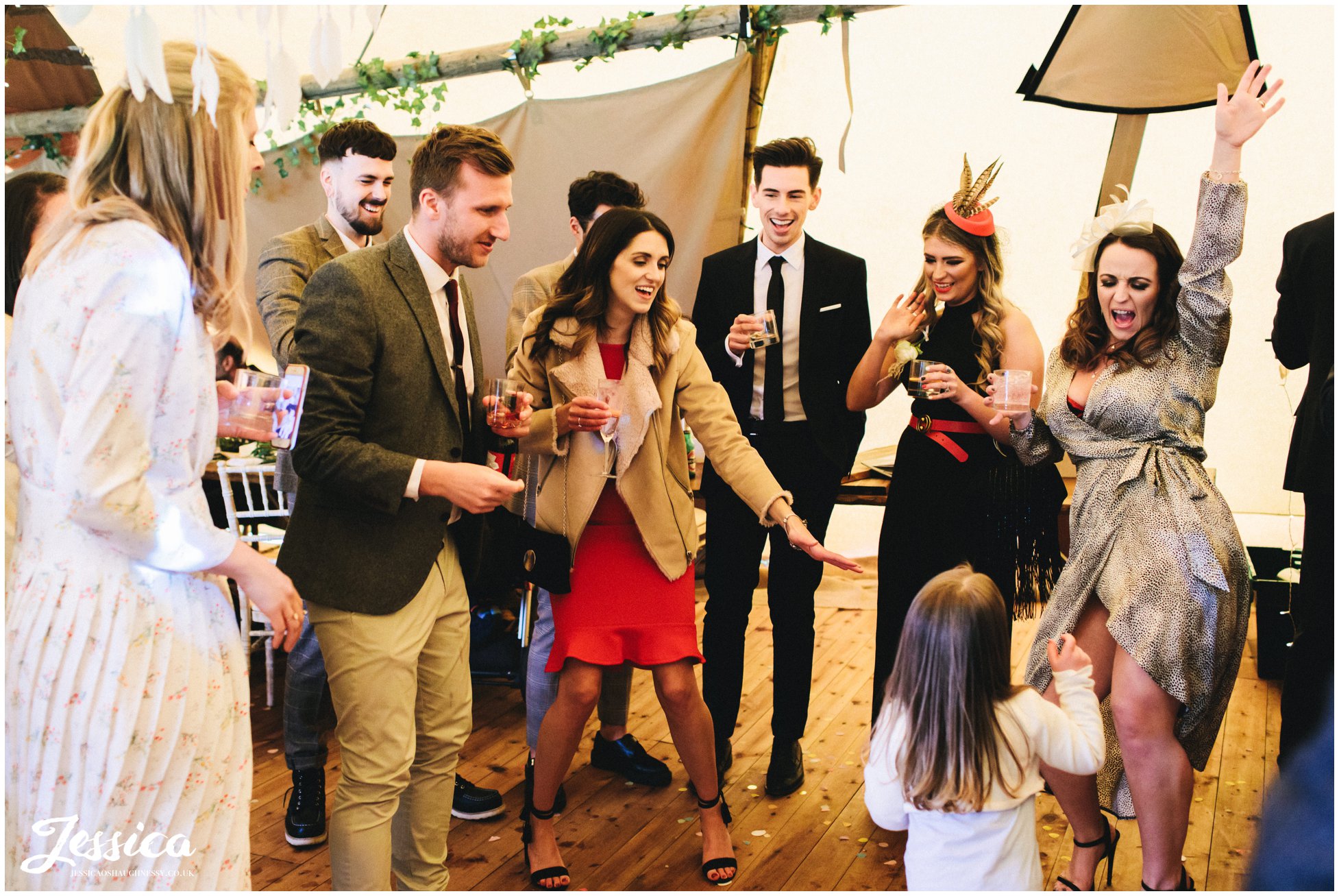 wedding guests cheer on child as she sings and dances to frozen
