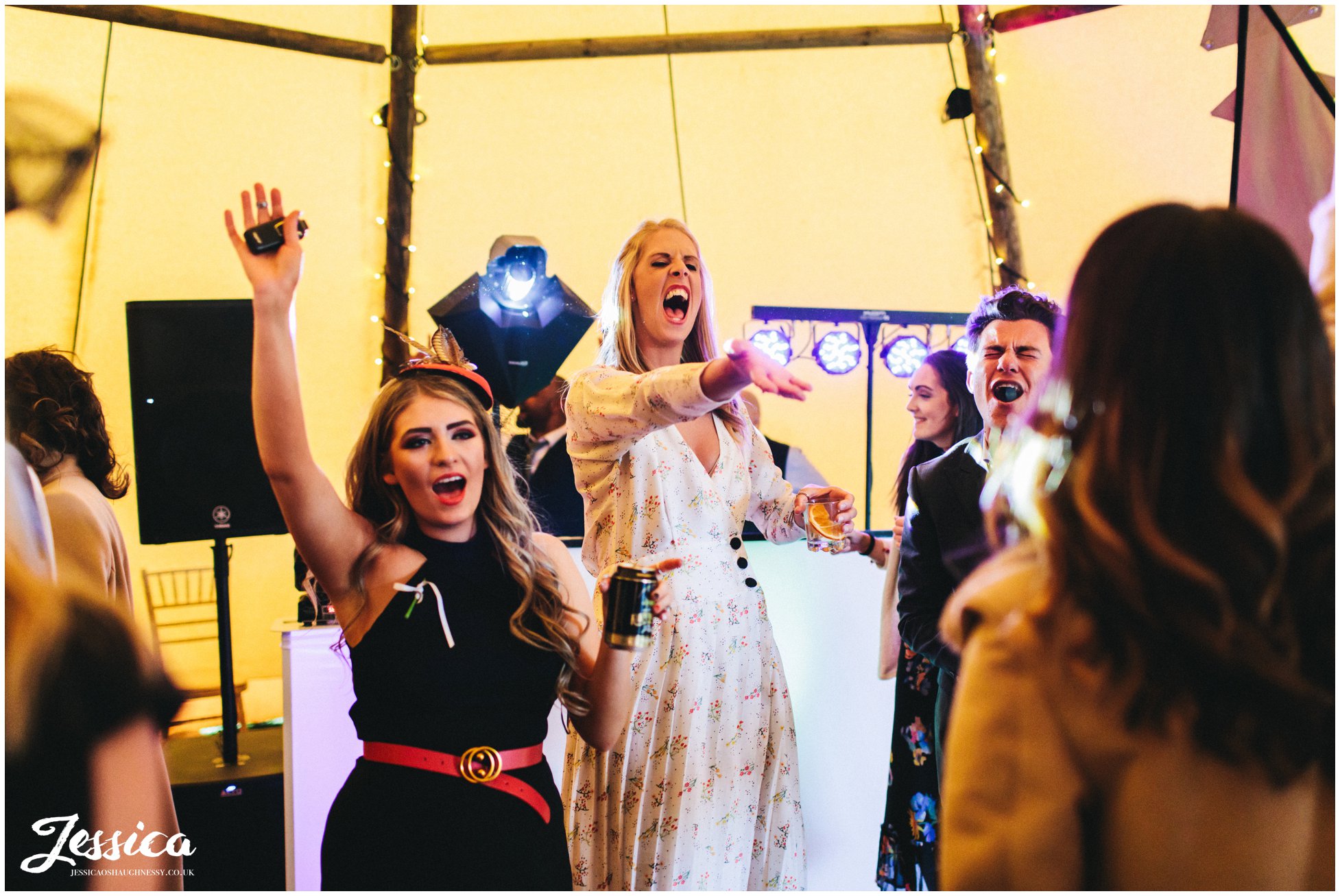 guests sing and dance as the wedding party gets started