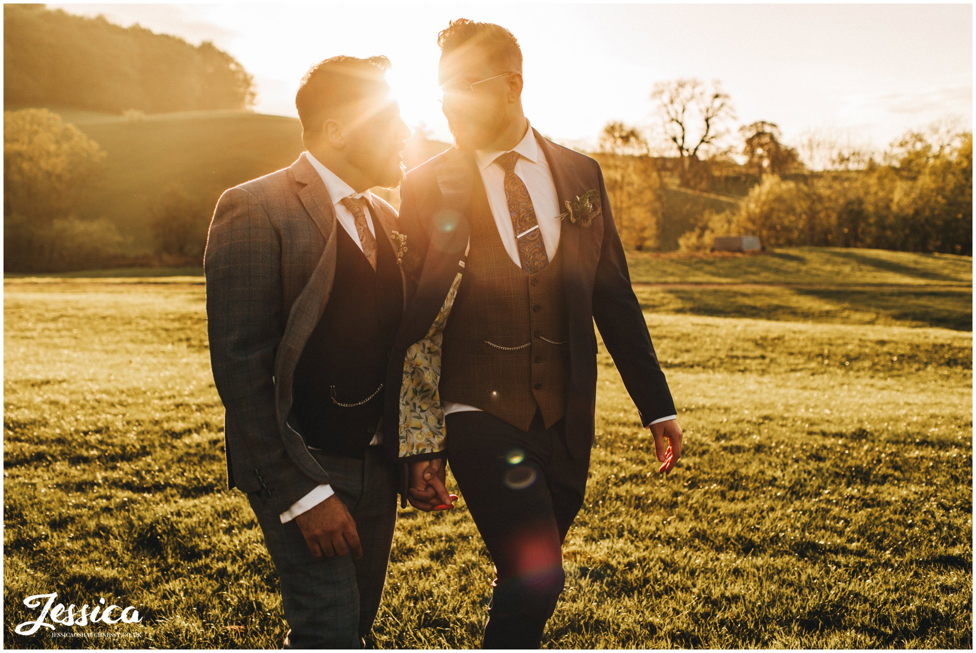 Groom's walk through the field together in the evening