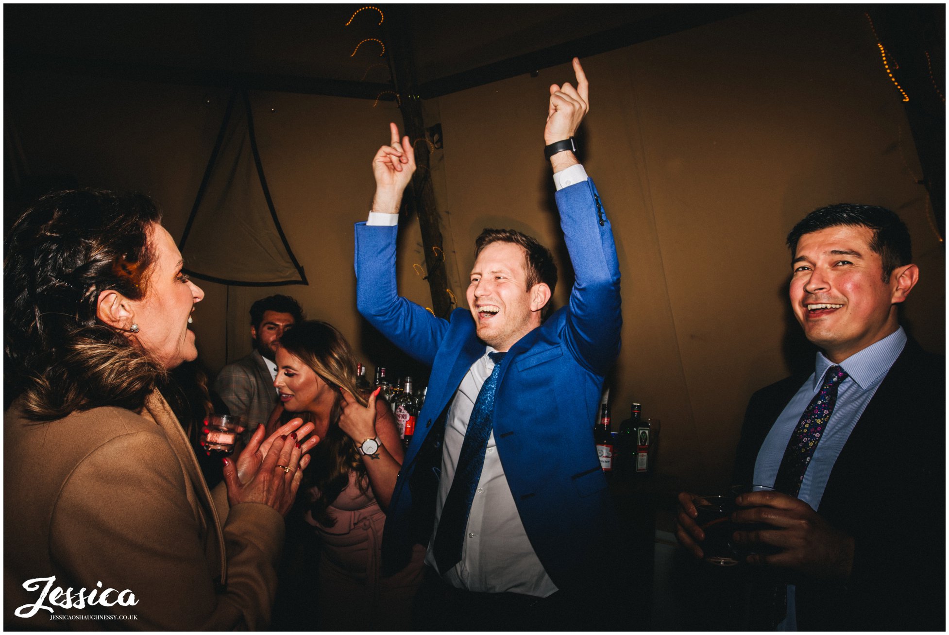 guest throw hands in the air on the tipi dancefloor