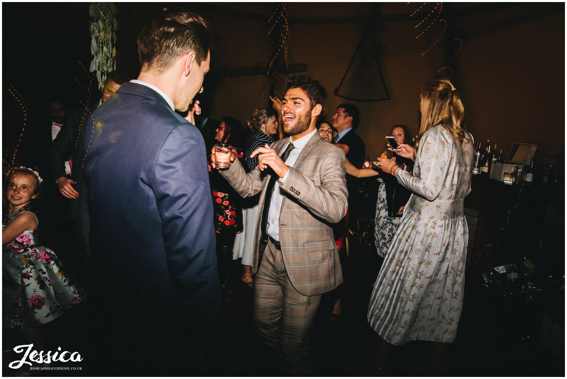wedding guests enjoy the music at the lake district wedding